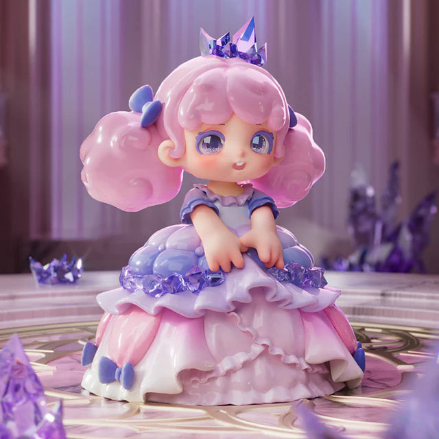 Chibi-style figure from Miana The Sleeping Castle Series Blind Box, featuring pink pigtails, a crystal crown, and a layered gown, posed on a crystal platform.