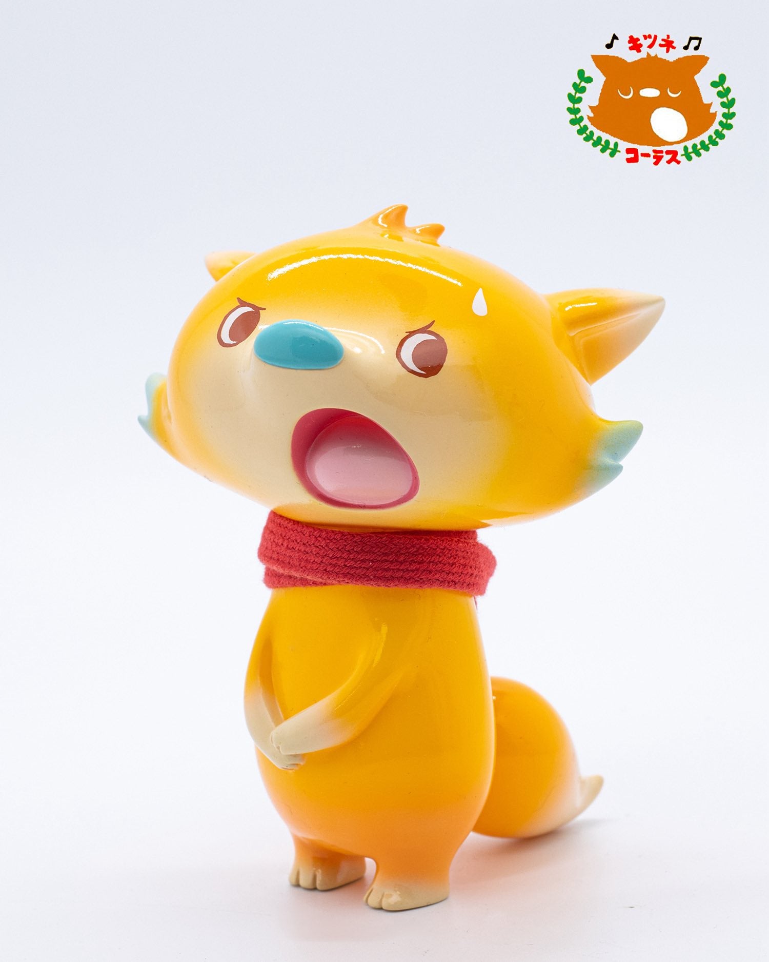 Fox Chorus Serie - Billy by Ok Luna: A 12.5cm glossy orange fox figurine with a surprised expression, red scarf, and pastel-green accents.