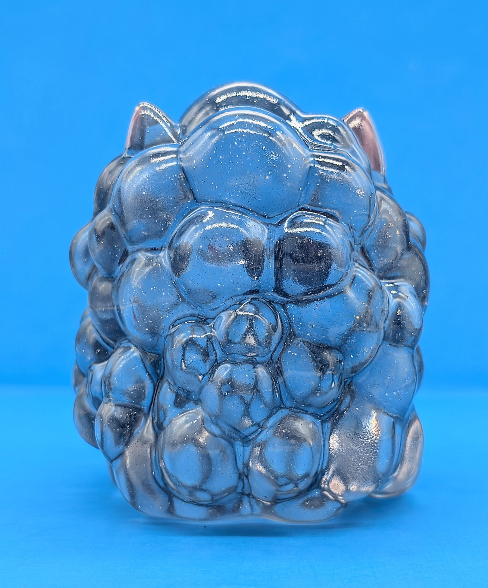 Kumo Kitty - Stormy Skies: A 4-inch translucent resin sculpture resembling a bubbly animal form with ears, capturing whimsical weather magic. Limited edition of 50 pieces.