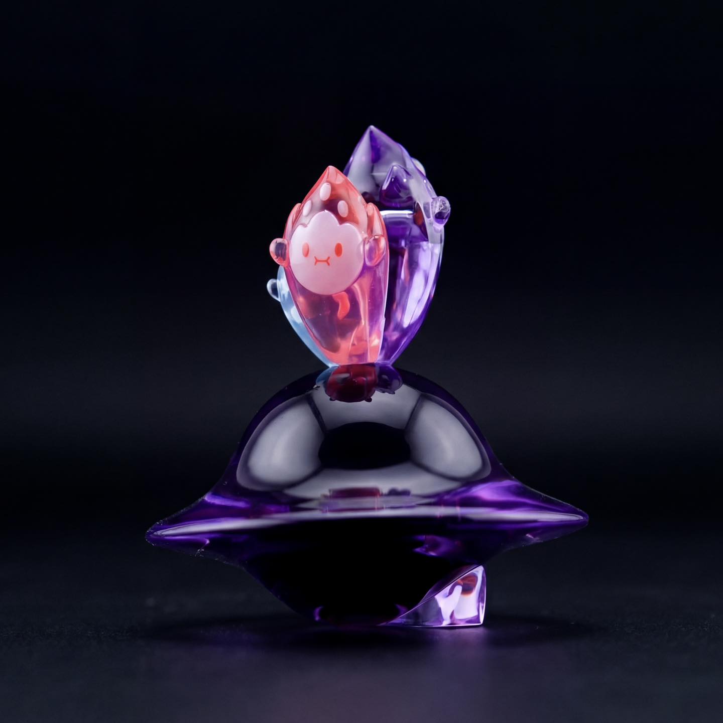 Flamey & Darkmite: Ember Void by MUPA x Yutoos, a glossy resin art toy with a purple base and abstract red figure, limited edition collectible.
