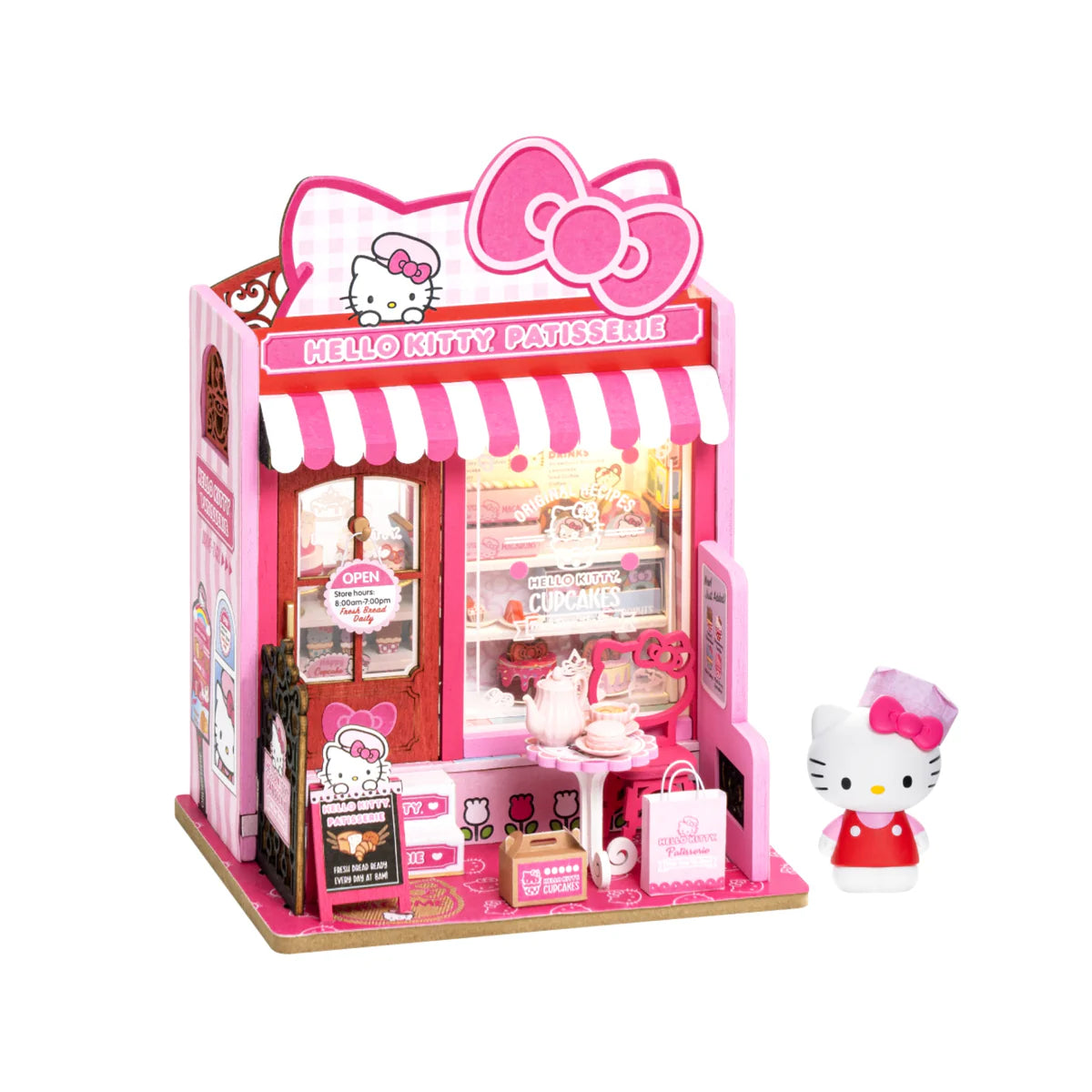 Hello Kitty Patisserie miniature playset with storefront, pastries, café table, and Hello Kitty figurine in baker’s attire; ideal for collectors and DIY enthusiasts.