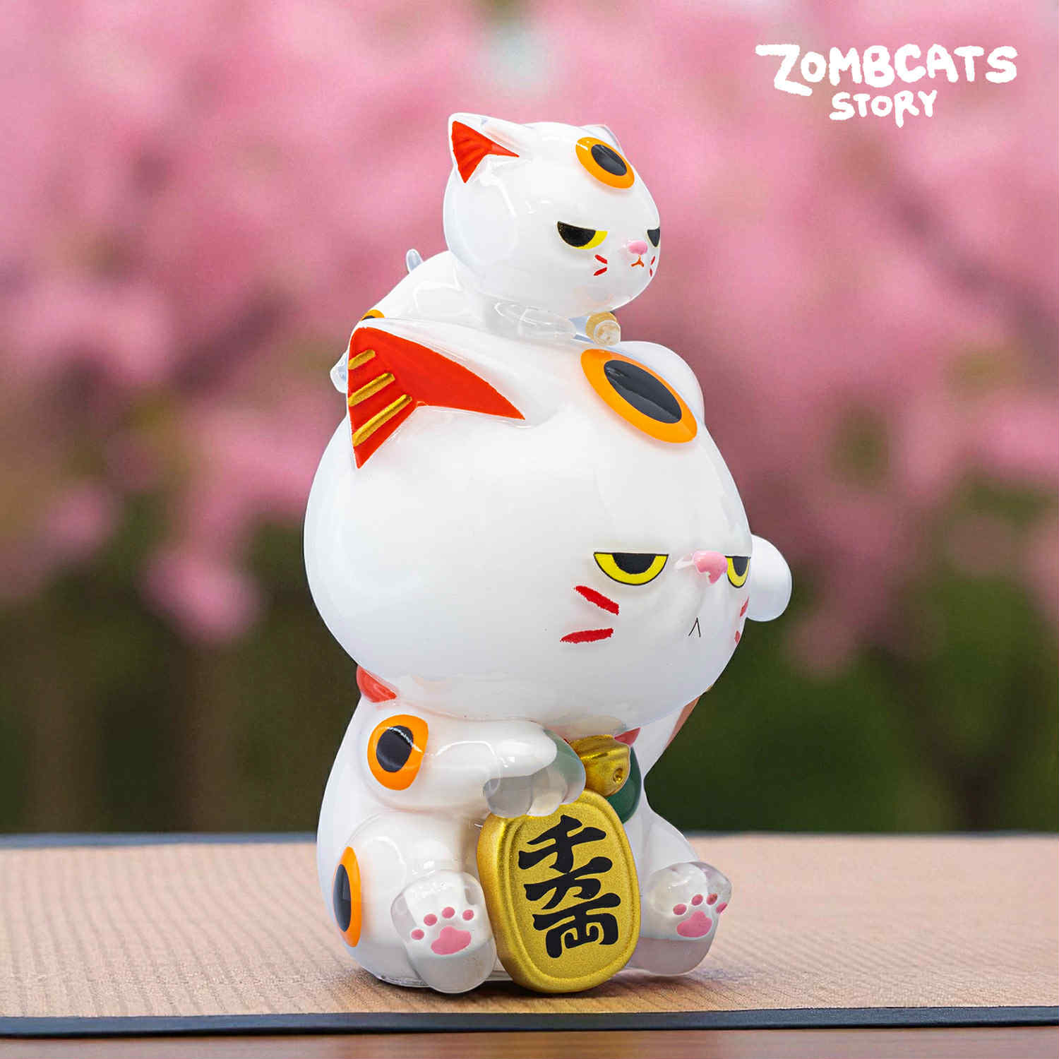 Zombcats Story - Grumpy Maneki LOTTERY figure: a white cat with gold coin, smaller cat on head, soft vinyl, preorder for Strangecat Toys.