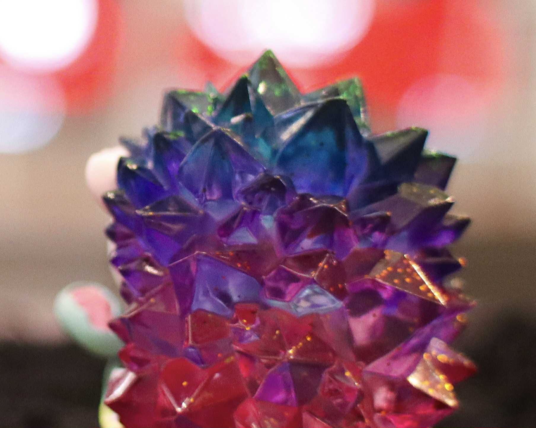 Spooky Zombie Hogkey by Tangent, a preorder resin sculpture, features a faceted orb design with an iridescent finish, measuring 8 cm.