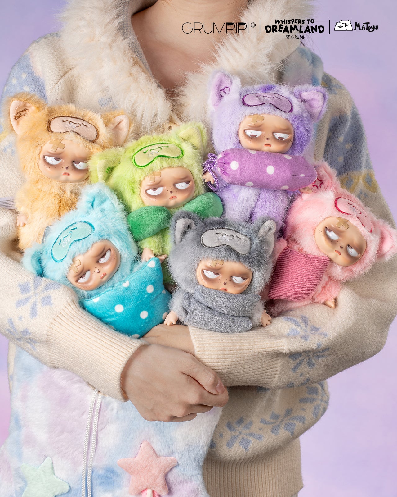 Hand holding plush keychain dolls, “Sleepless Grumpipi Whispers to Dreamland,” in animal onesies, showcasing collectible blind box toys from Strangecat Toys.