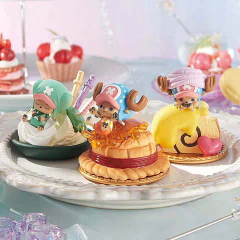 Trio of 'Tony Tony Chopper' figures from zZoton Winter's Small Joys Series Plush Blind Box, sitting on miniature desserts, displayed on a decorative plate.
