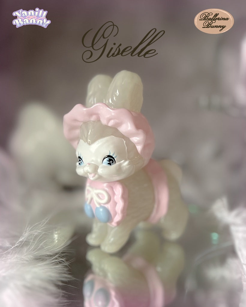 Vanilla Bunny - Ballerina Bunny by Ms LUTRA: Translucent resin figurine with pink ruffled bonnet, blue pom-poms, sparkly eyes, standing on a mirrored surface with feathers.