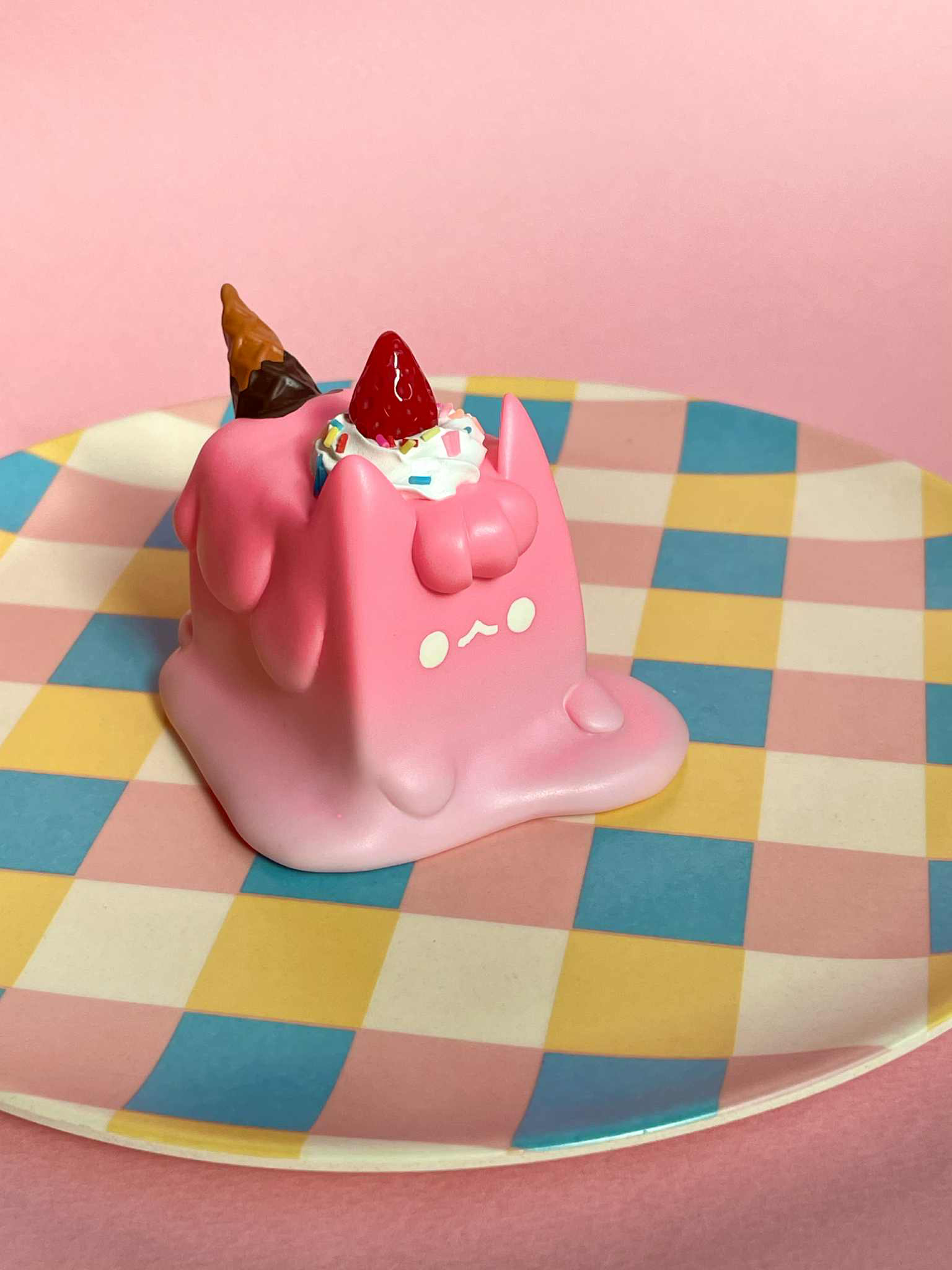 Strawberry Cream Ice Cream Cat by Rato Kim, a kawaii sofubi toy, features a pink melting cat with sprinkles, strawberry, and waffle cone. Preorder for October 2025.
