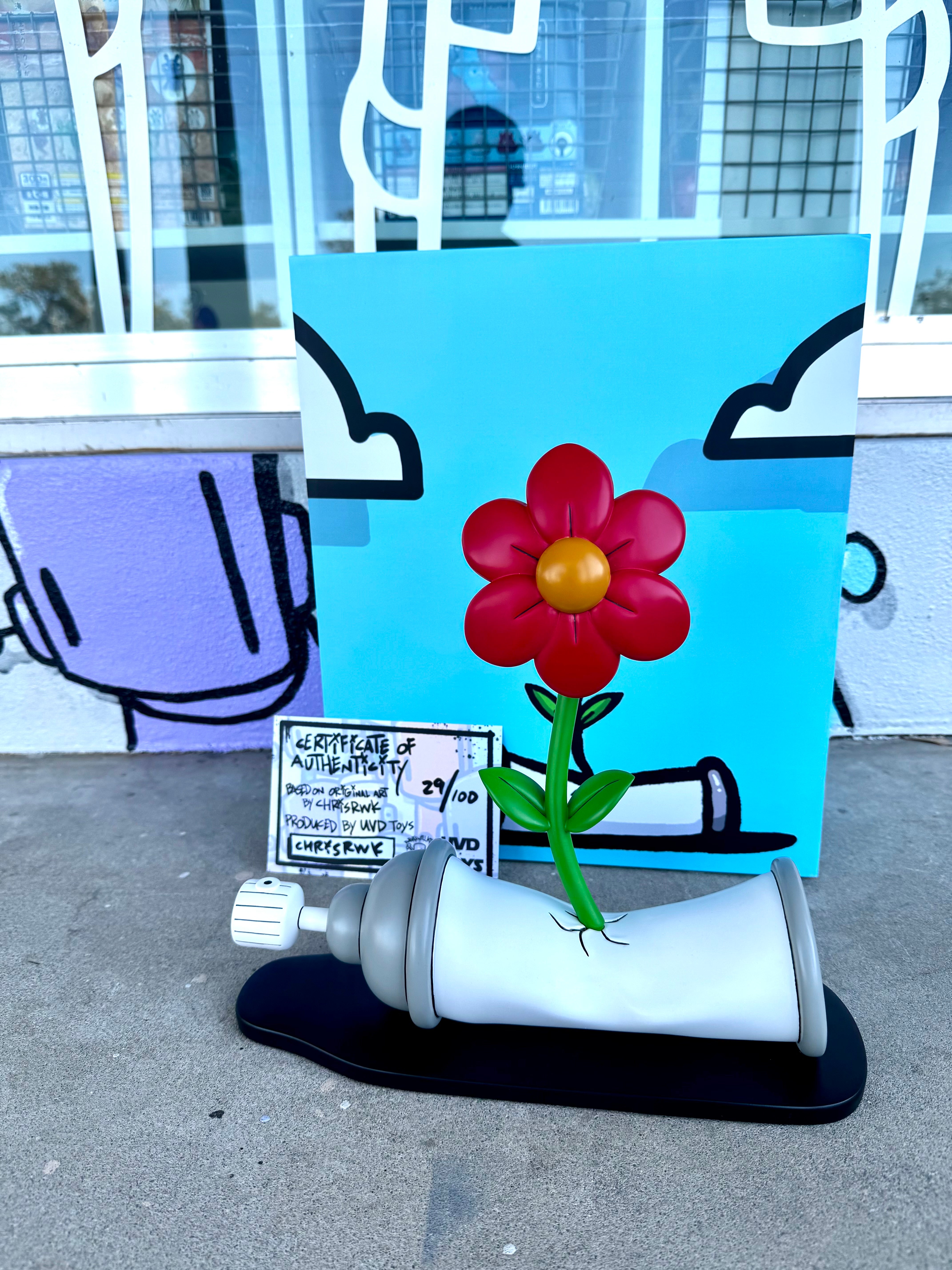 Bloom Through Resin Art by ChrisRWK, featuring a flower emerging from a shoe, includes a signed and numbered certificate. Limited edition, 11 tall.