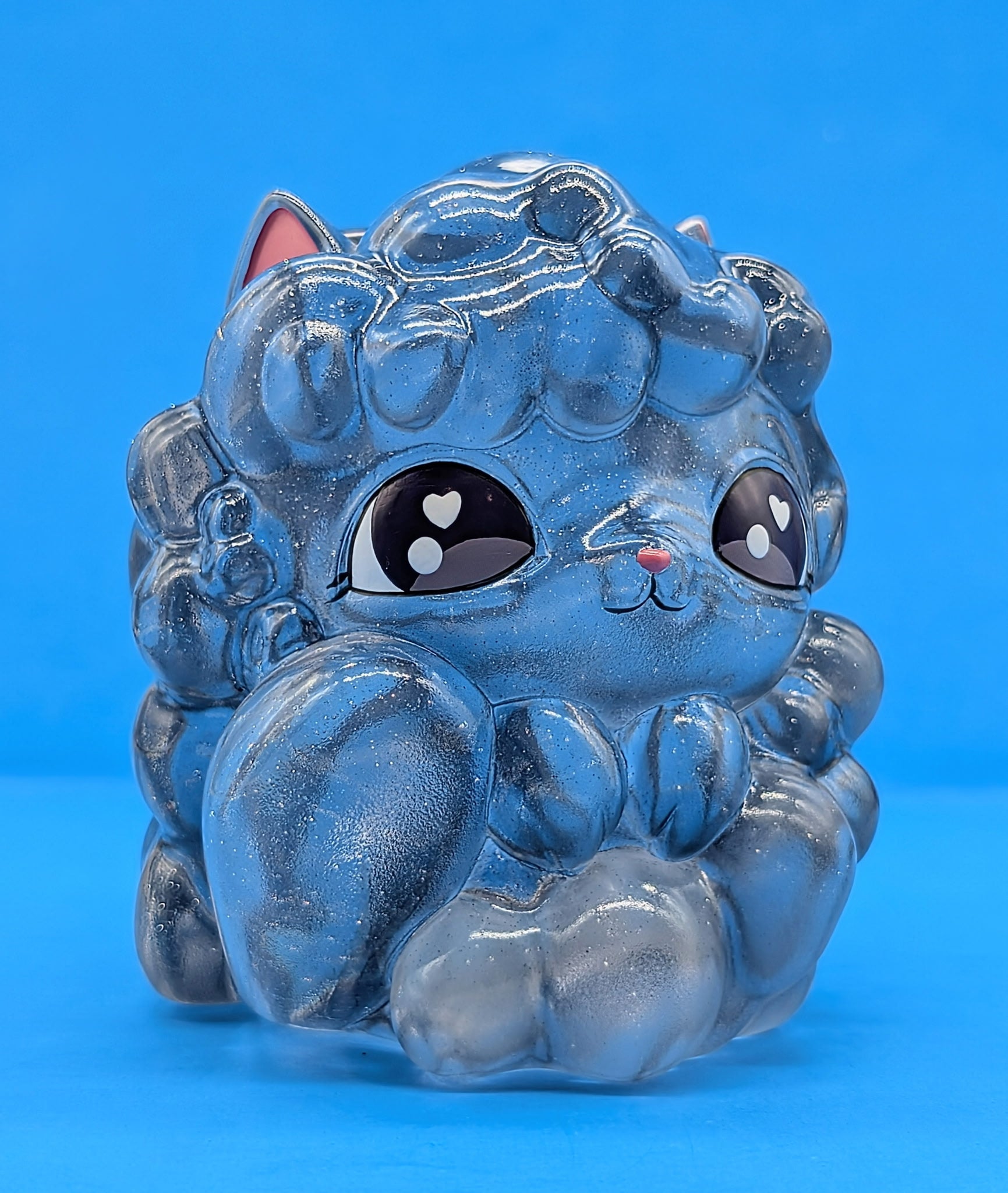 Kumo Kitty - Stormy Skies by The Bots: A 4-inch, glitter-filled, translucent cat figurine with heart-shaped pupils, capturing whimsical weather magic in collectible art toy form.