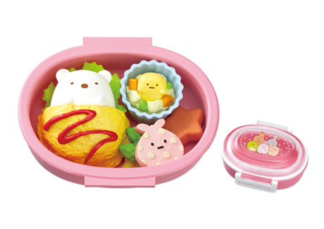 Sumikko Bento Re-ment Blind Box Series: features a kawaii bento set with adorable food shapes inside and a matching pink lid with Sumikko Gurashi characters.
