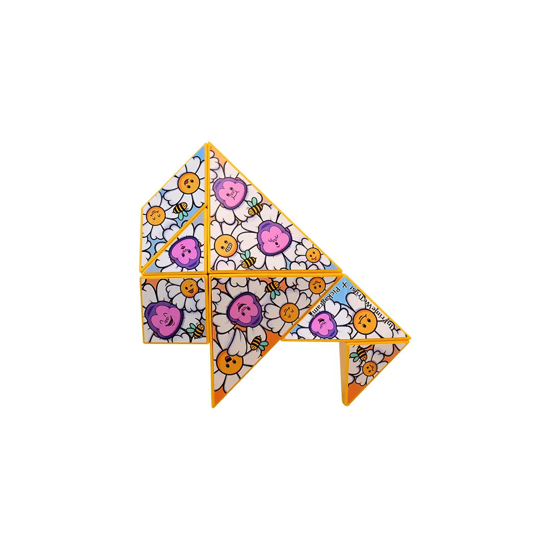 Art Pickagram 3D Puzzle X Artist_04 Xavier Alvarez, a limited-edition magnetized puzzle with daisy, bee, and flower motifs on yellow-edged hinged triangles.
