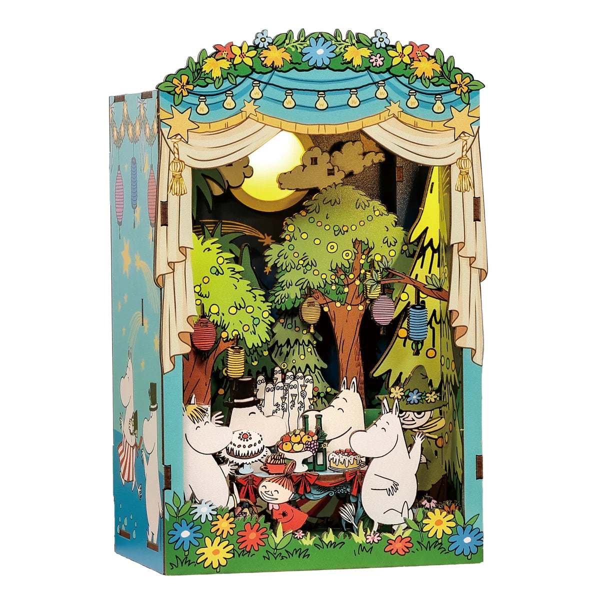 Moomin Moominous Dance Party DIY Book Nook showcases Moomins celebrating in a moonlit forest scene with paper lanterns, picnic table, and touch-activated LED lights.