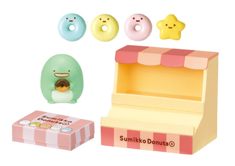 Freshly Fried Sumikko Donuts Re-ment Blind Box Series: Miniature diorama with character-themed donut rings, Penguin? figure, and display stand. Collect all eight designs.