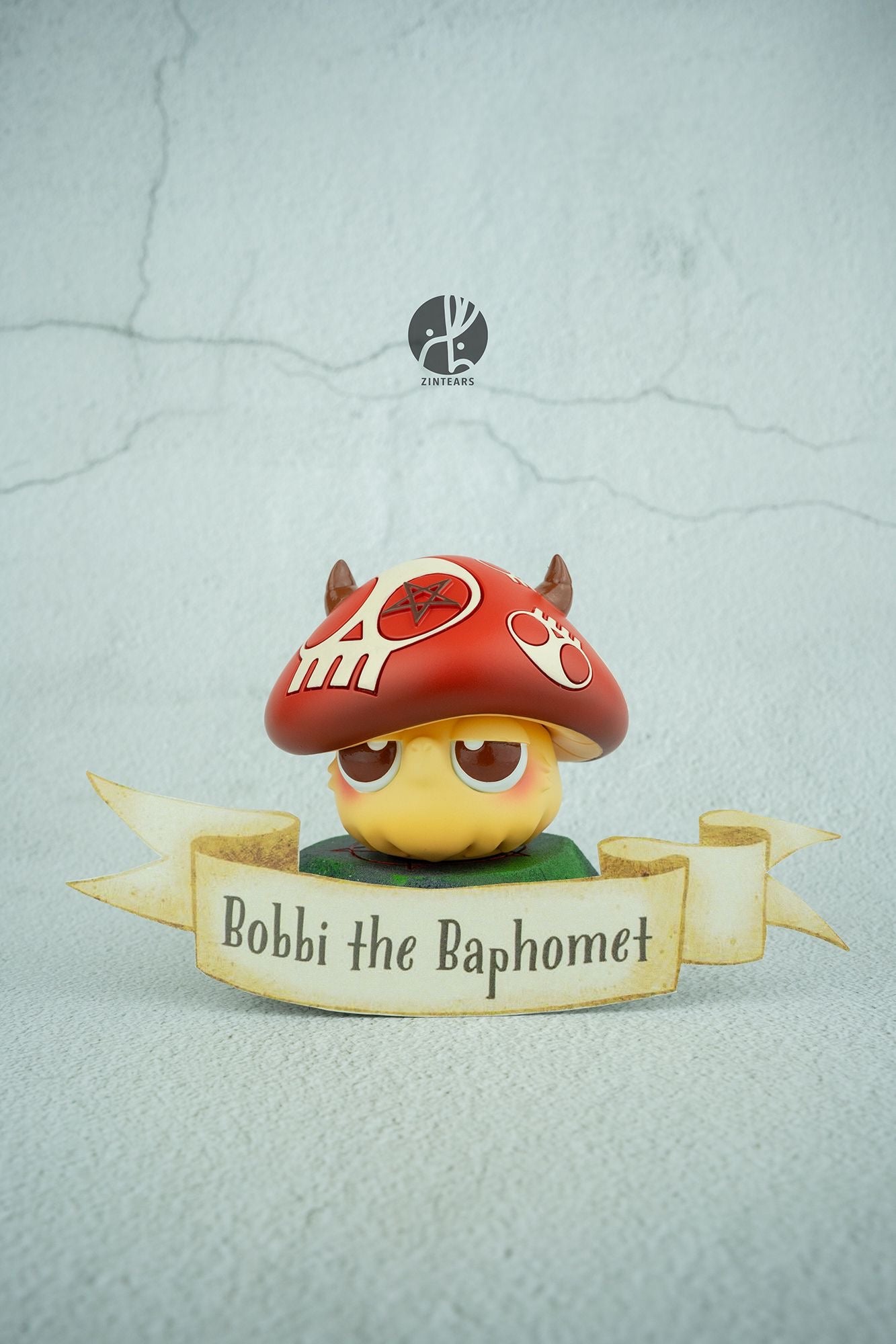 A blind box toy: Mushroom Bobbi by Zintears, a resin figure with a red hat and horns, 7 cm tall, limited to 50 pieces. Preorder - Ships Aug 2024.
