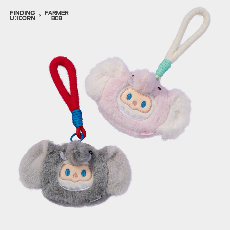 FINDING UNICORN FARMER BOB FURRY COIN PURSE: Two plush bag-charms with looped cords, fuzzy bodies, and embroidered faces, perfect as key-chain accessories.
