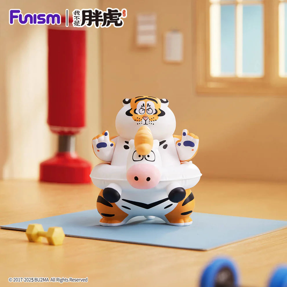 Alexander The Fat Tiger toy, sitting in a pig/unicorn swim ring, includes exercise mat, dumbbell, and punching bag. Part of The Real Crazy Horse Blind Box Series.