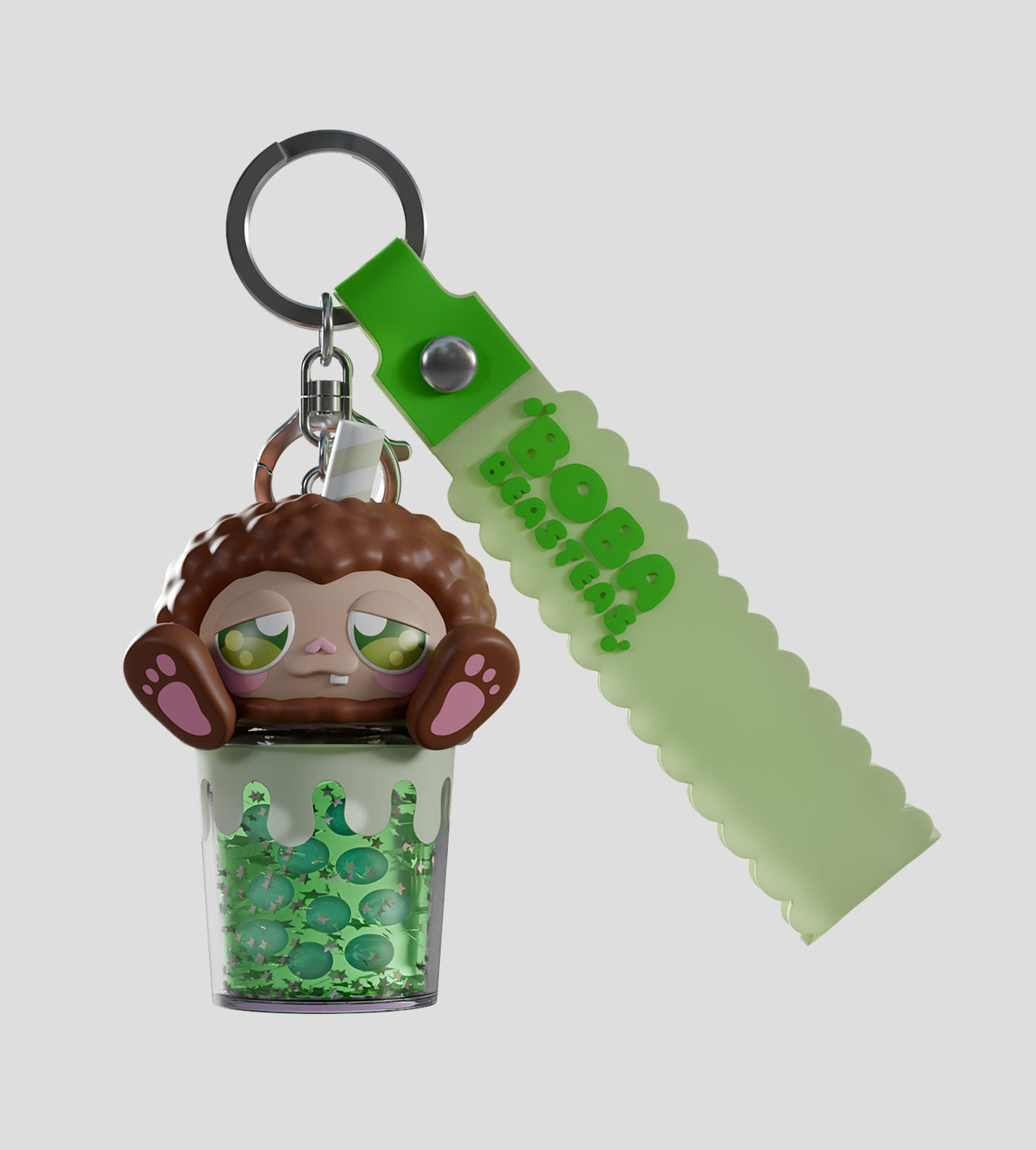 Boba Beasteas Blind Box keychain: cartoon beastie in glittery bubble-tea cup with BOBA BEASTIES strap; preorder from Strangecat Toys.