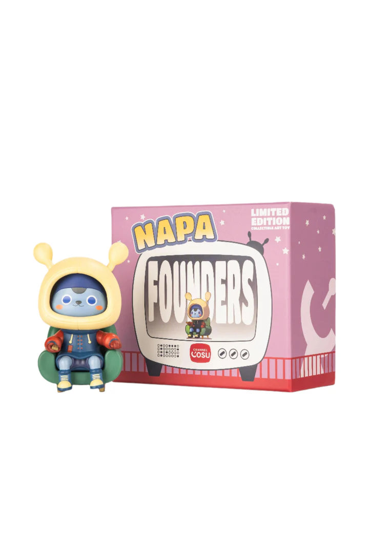 Napa Series One: Blue vinyl figure in yellow hood on green armchair, with NAPA FOUNDERS packaging, a limited-edition collectible from Strangecat Toys.