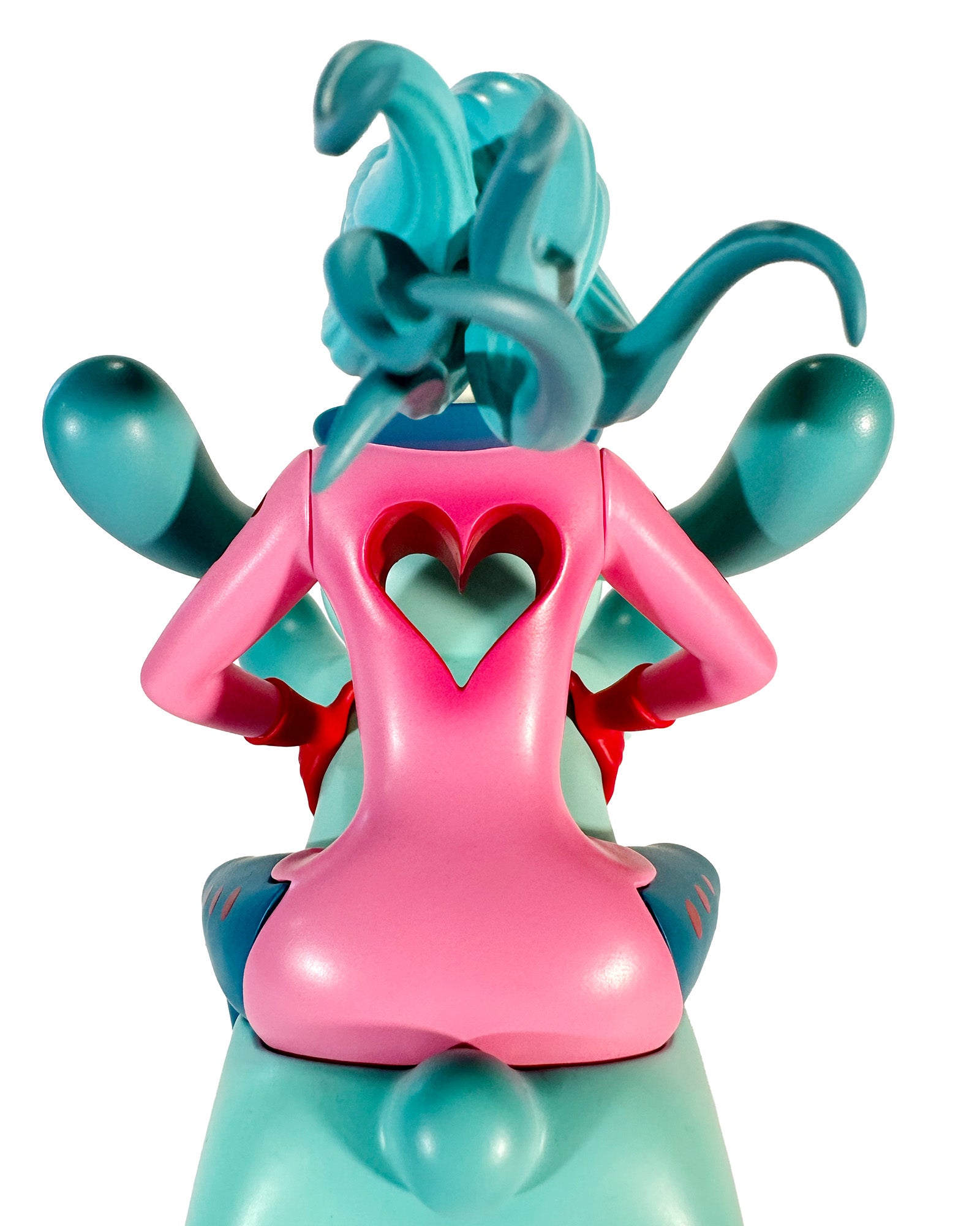 The Bunny Rider by Tara McPherson, a 6-inch resin figure, features tentacle-style hair and a heart cutout in a pink coat, gripping a teal scooter.