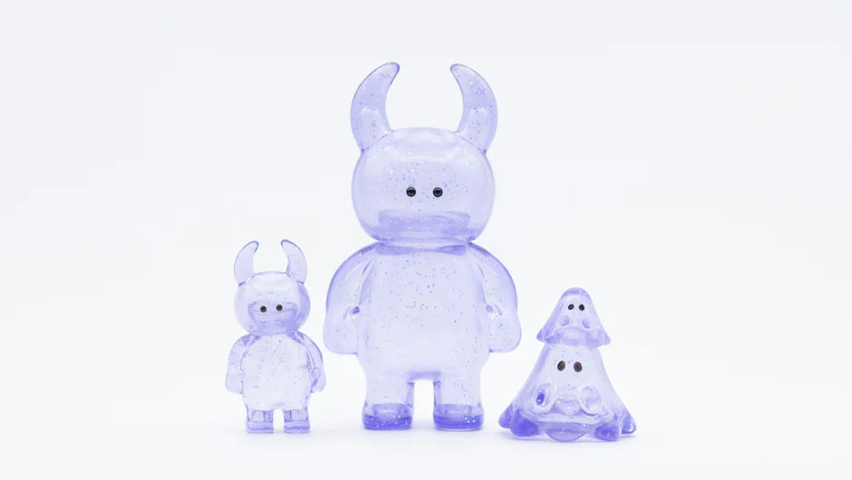 MINI BOO CLEAR LAVENDER GLITTER: Three small, translucent, glittery, soft vinyl toy figures—two horned monsters and one ghost-like shape—crafted in Japan.