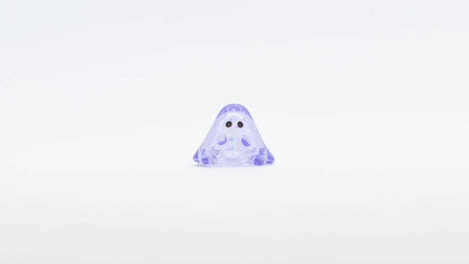 MINI BOO CLEAR LAVENDER GLITTER: A 1cm translucent purple ghost-like vinyl figurine with black-dot eyes, perfect for art toy enthusiasts.