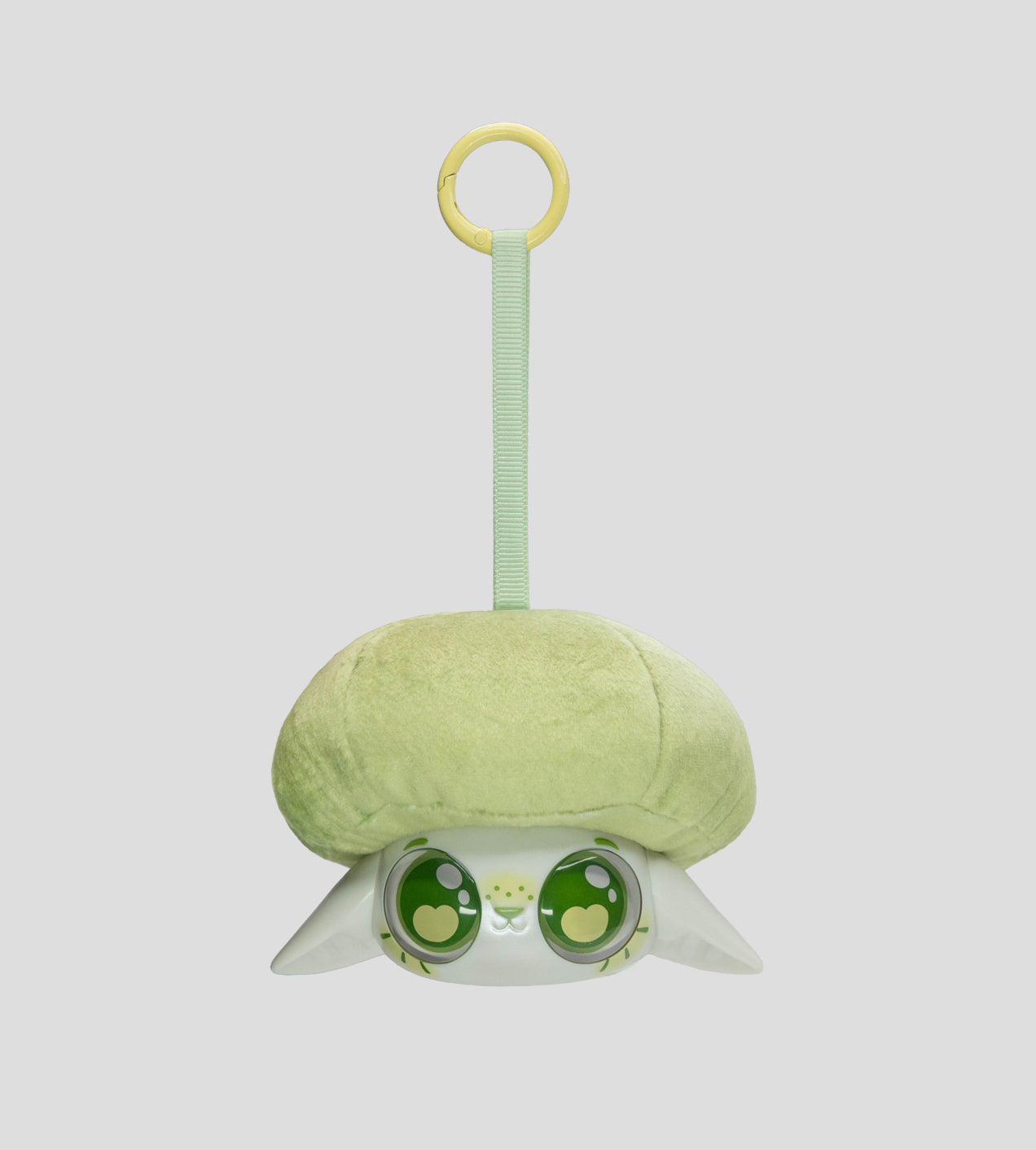 Capkins - Plush Bag Clip: A cute, small, upside-down plush toy animal head with a pastel-green mushroom cap, attached to a yellow plastic ring keyring.