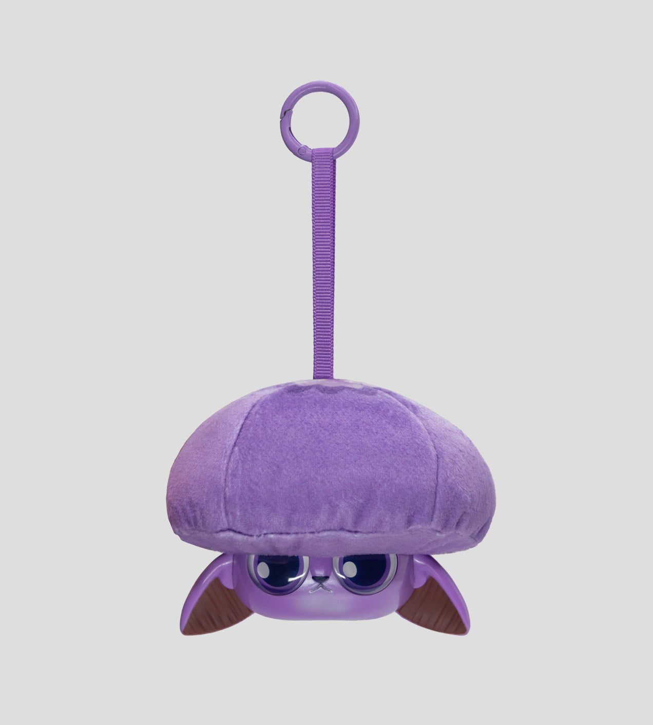 Capkins - Plush Bag Clip: A purple character keychain with a mushroom cap, cartoon eyes, floppy ears, and a strap, perfect for bags or keys.