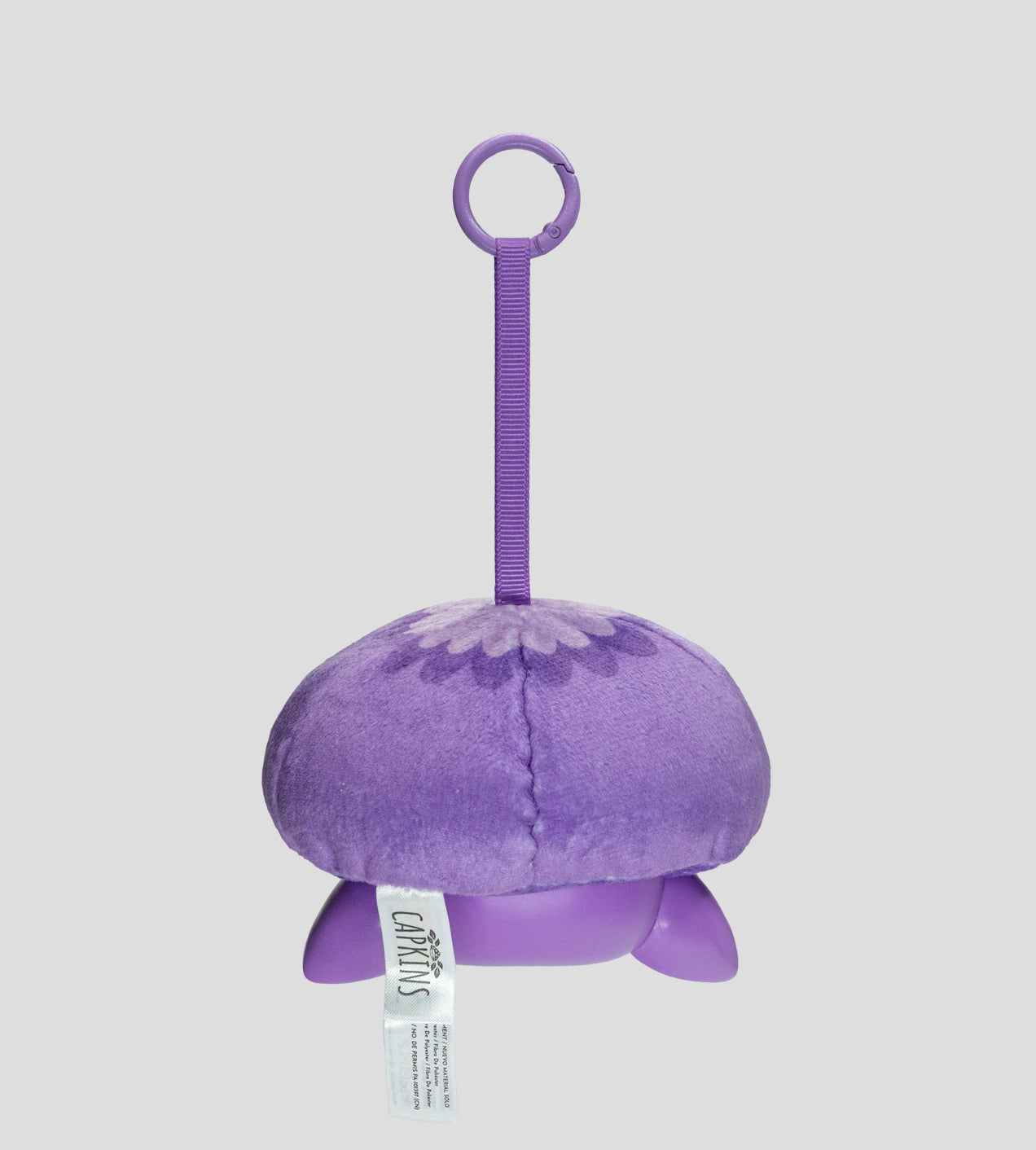 Capkins - Plush Bag Clip, a small mushroom-shaped toy with a purple strap, velvety dome, and plastic feet, featuring Carlins brand tag.