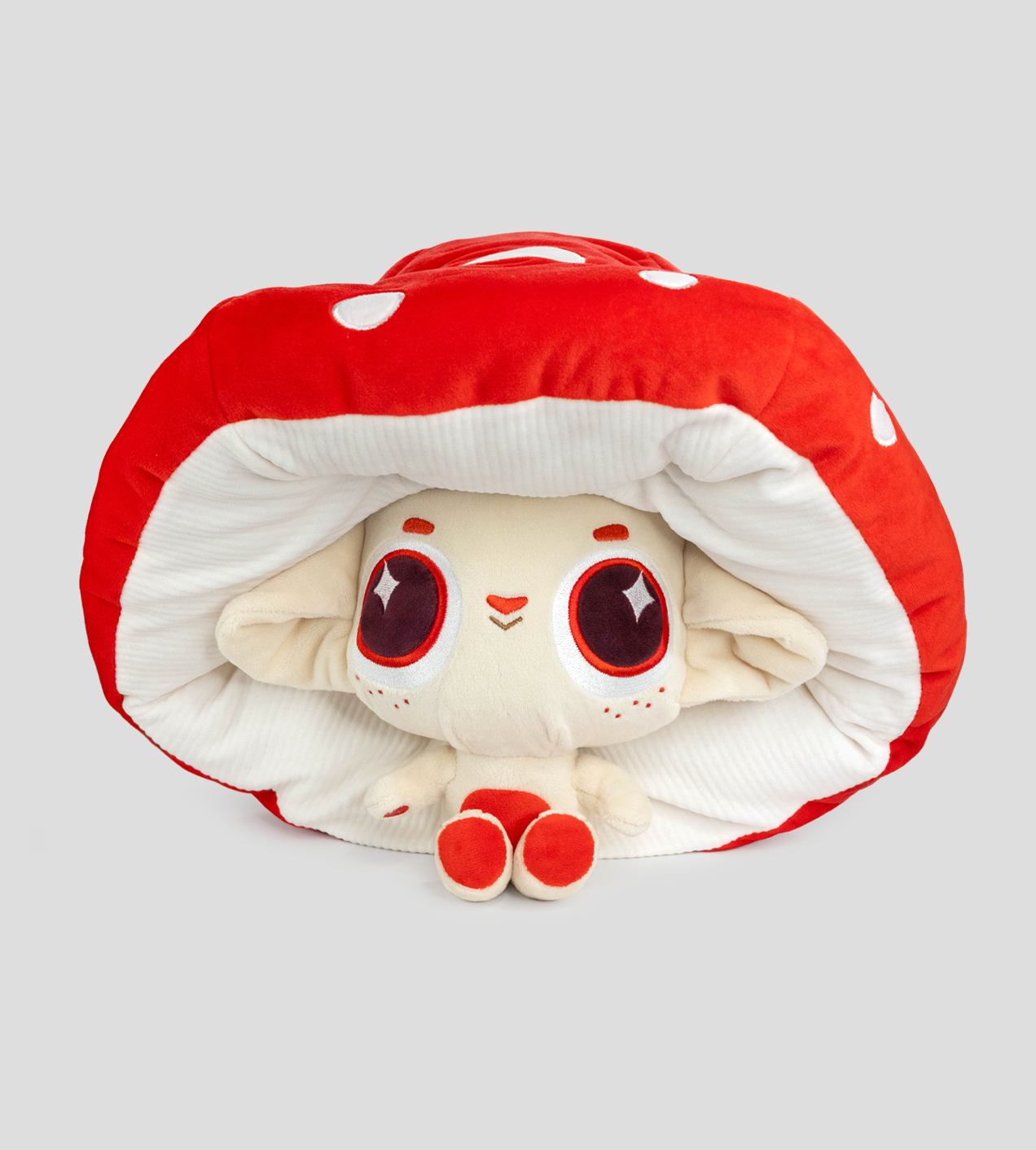 Capkins Peek-A-Boo Plush features Fly, the round-eyed creature inside a cushioned toadstool cap with floppy ears, embodying playful mystery from Strangecat Toys.