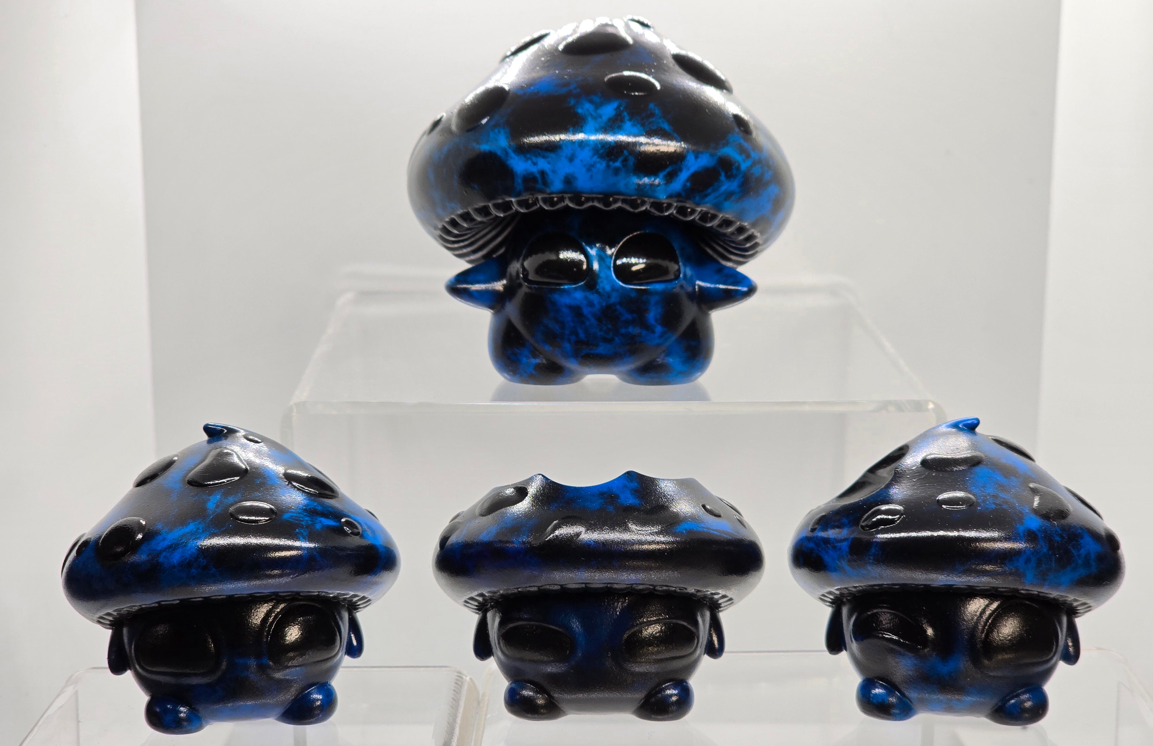 Bite Me - Bites by Neff's Nexus, a blue and black epoxy resin toy with intricate helmet design, featured at Strangecat Toys.