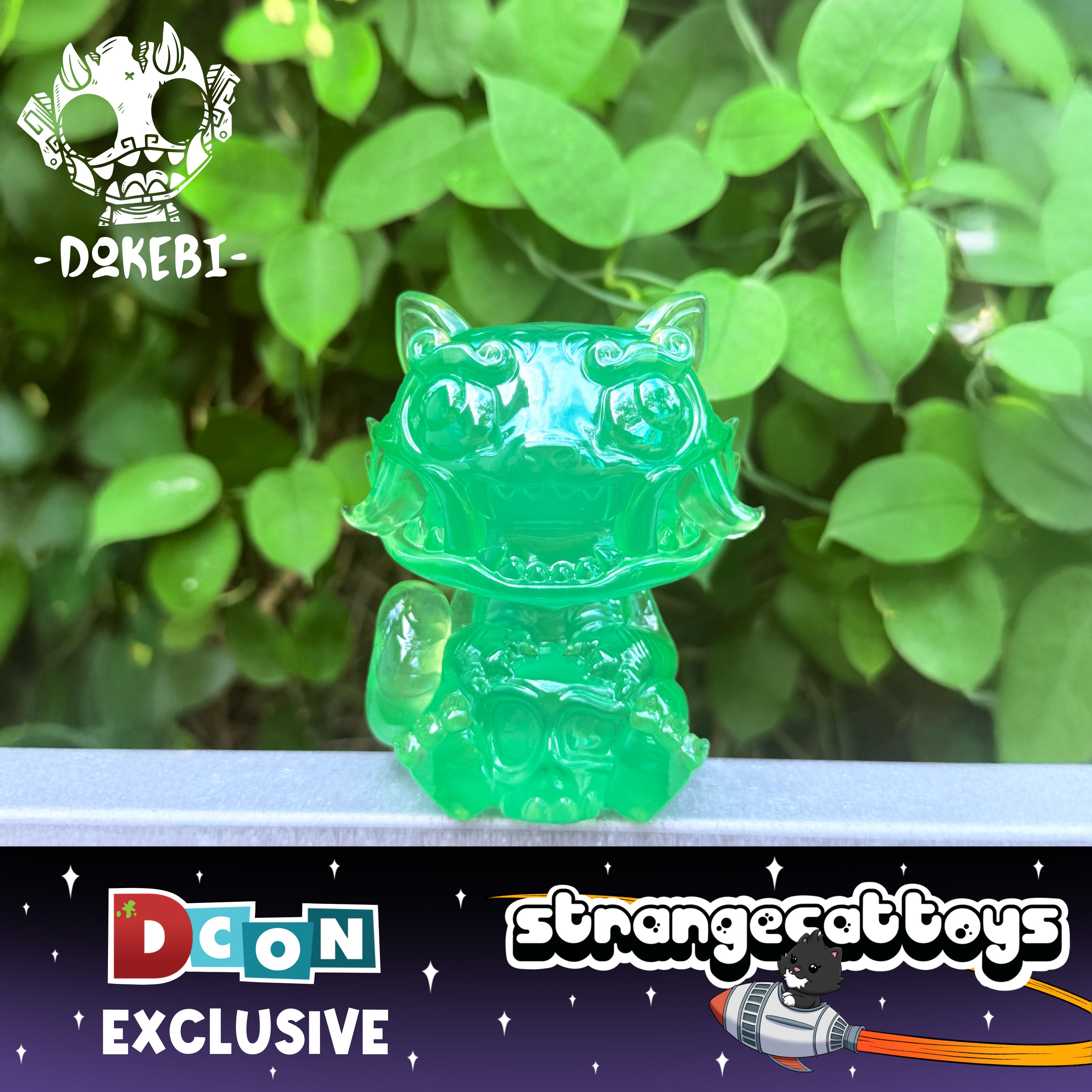 RuRu by Tomodachi Island: a translucent green vinyl dokebi figure, exclusive to DCon, perched on a ledge with lush foliage backdrop.