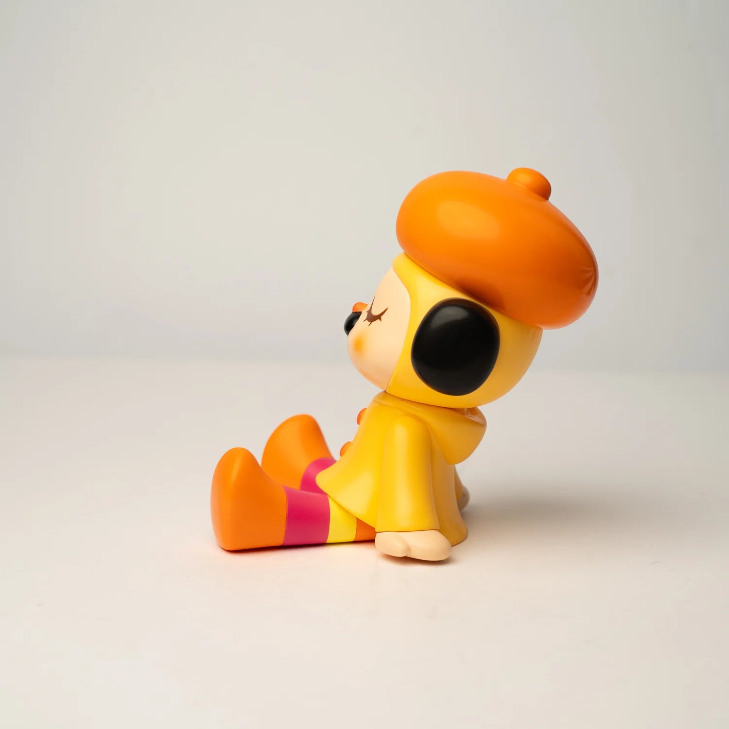 GREENIE OHIGEnoPON EDITION - Preorder: A stylized 14cm vinyl figurine with an orange beret, yellow coat, and striped leggings, designed by Too Natthapong.