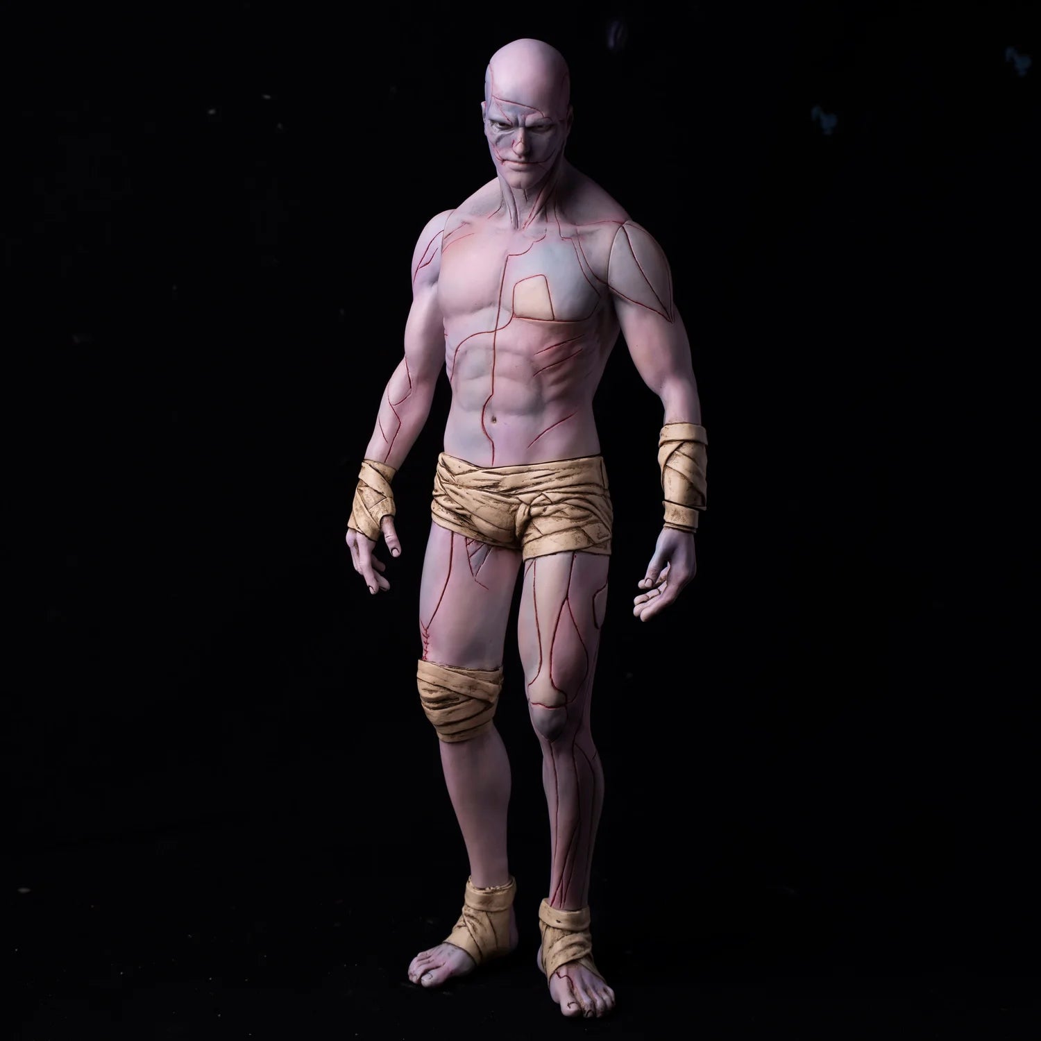 FRANKENSTEIN: THE CREATURE V1, a 30cm stylized soft vinyl figure with anatomical details, wrapped in tan bandages, embodying gothic art and horror.
