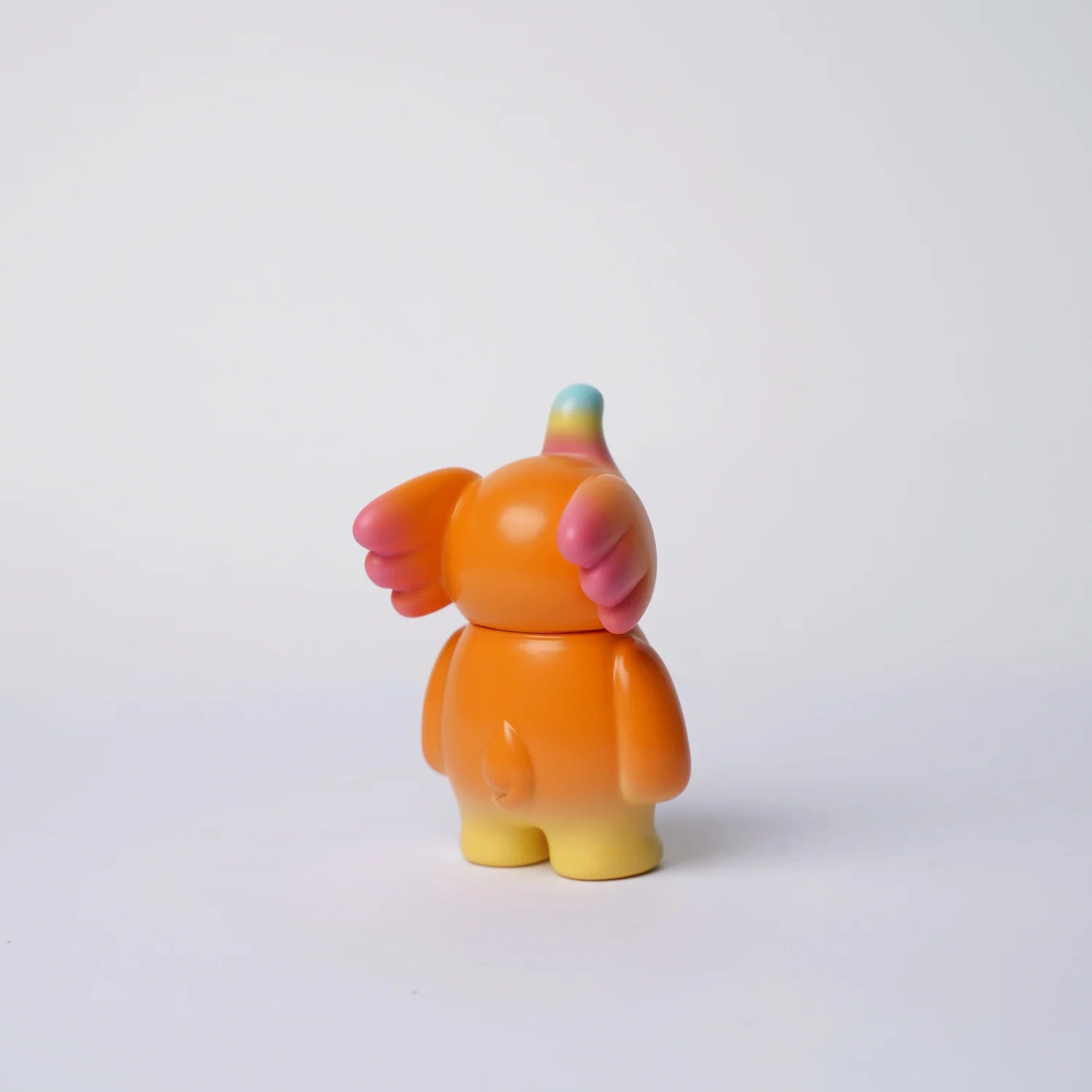 ELFIE HERE I AM! 100% PUMPKIN EDITION vinyl toy, 3 inches tall, featuring warm hues with rainbow horn and petal-like wings, designed by Too Natthapong.