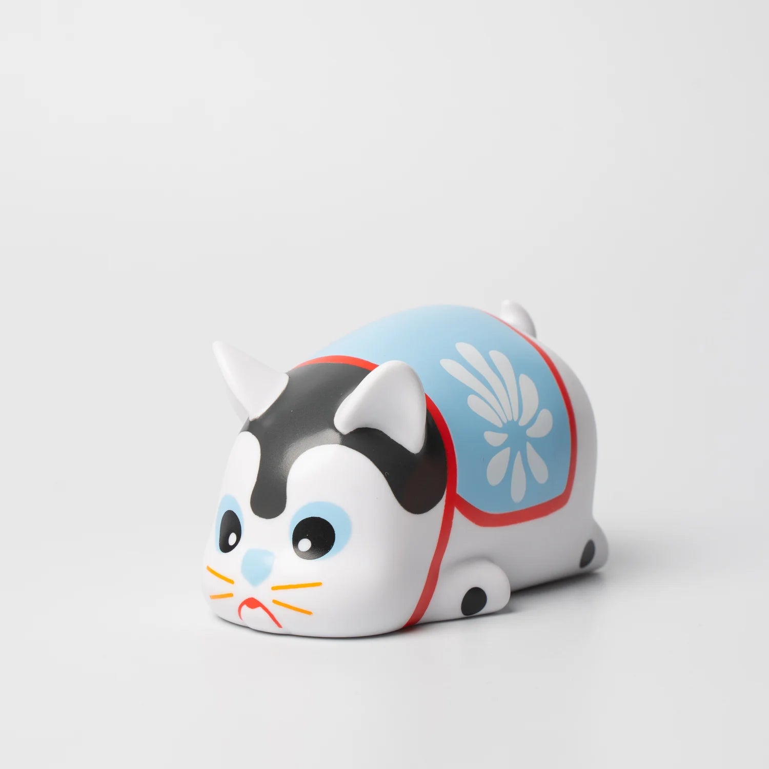 A blind box and art toy store presents NIMBUS HARIKO TTE EDITION. A small toy cat with a blue and white design, soft vinyl material, and hand-painted details by Paulus Hyu.