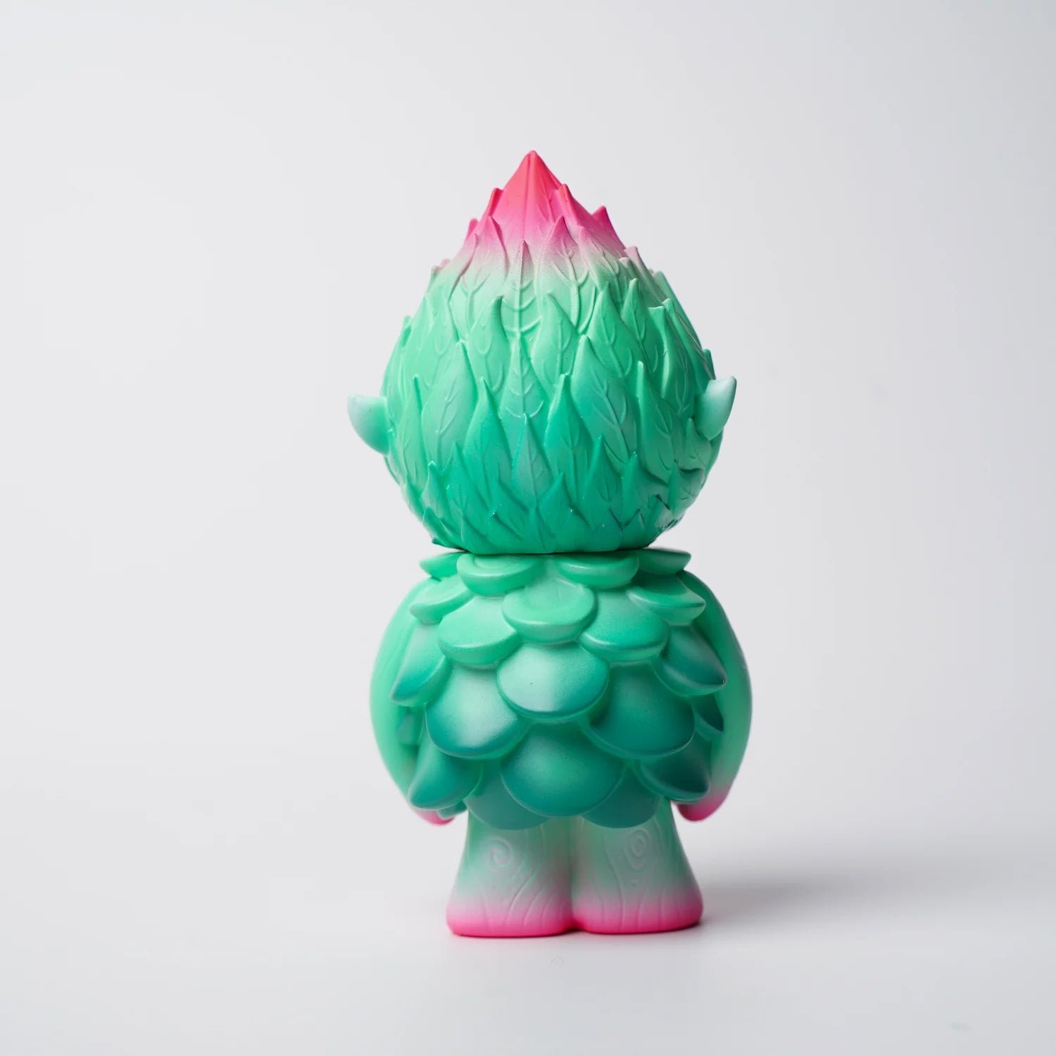 MUJUWORLD TREE SPIRIT SPRING EDITION - Preorder: A 4 soft vinyl toy, resembling a nature spirit with leaf textures, transitioning from mint green to pink.
