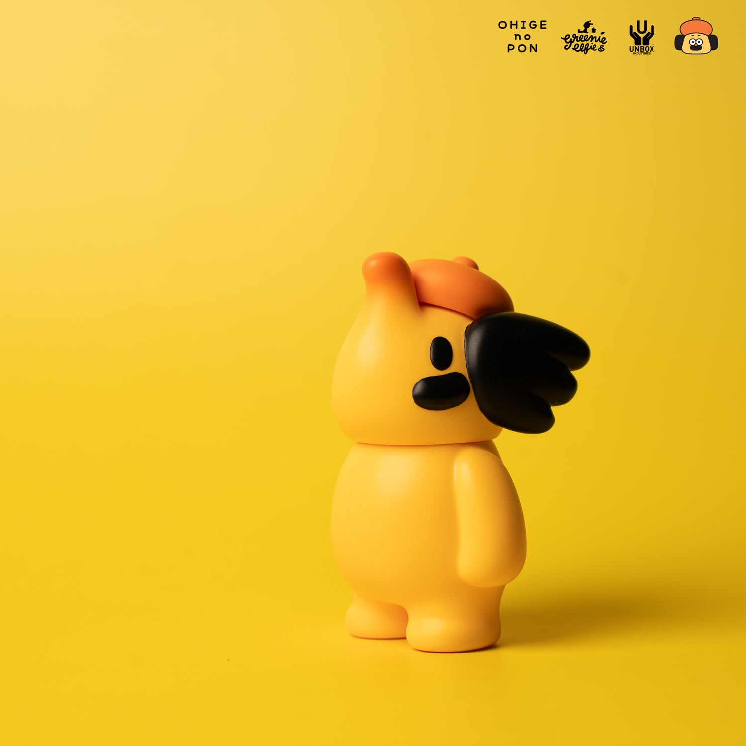 ELFIE HERE I AM! 100% OHIGEnoPON EDITION vinyl figure with a mustache accent, yellow-orange body, and cap, showcased for preorder at Strangecat Toys.