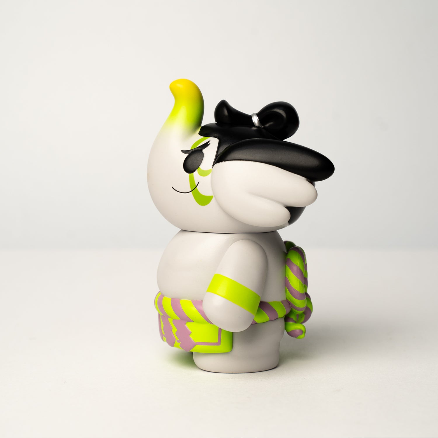 Traveller Elfie 'Sumo' Edition vinyl art toy in profile, featuring a unique chonmage hairstyle, neon accents, and a twisted rope belt, designed by TOO Natthapong.