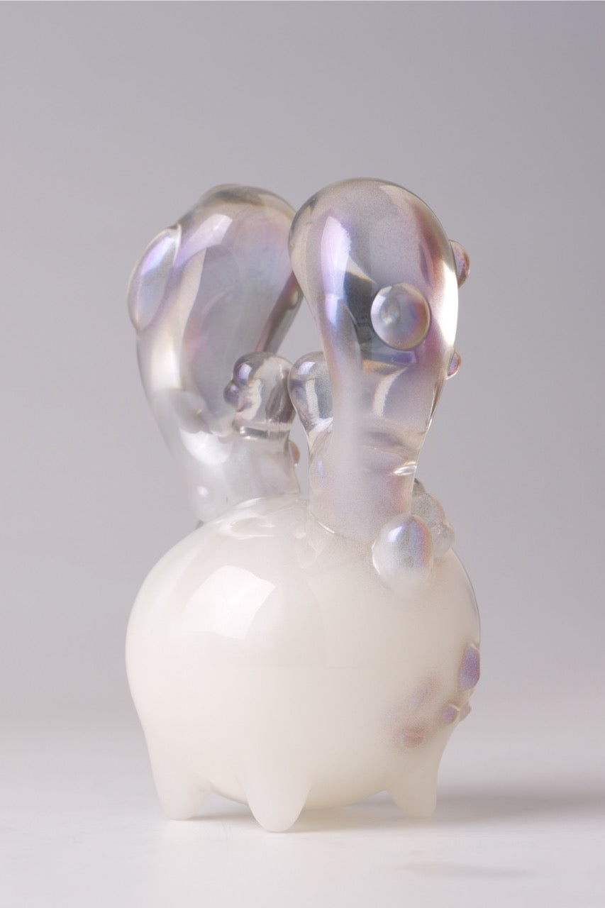 Coralite by Yutoos: A 4-inch, glossy, abstract resin sculpture with a milky-white body and iridescent, bubble-nodulated appendages. Limited to 50 pieces.