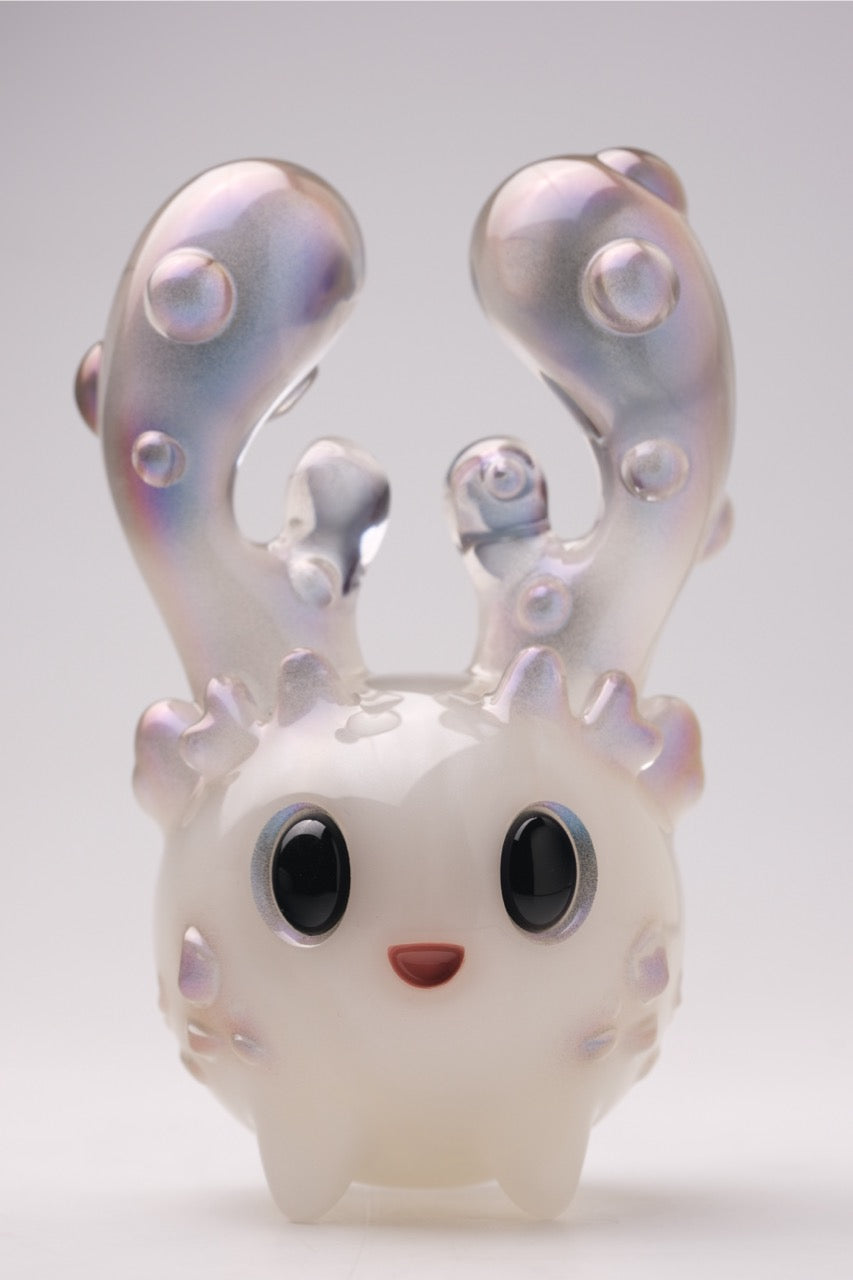 Coralite by Yutoos: A 4-inch, resin art toy with a pearlescent finish, featuring big eyes, a smile, and bubble-covered coral-like horns. Limited edition of 50.