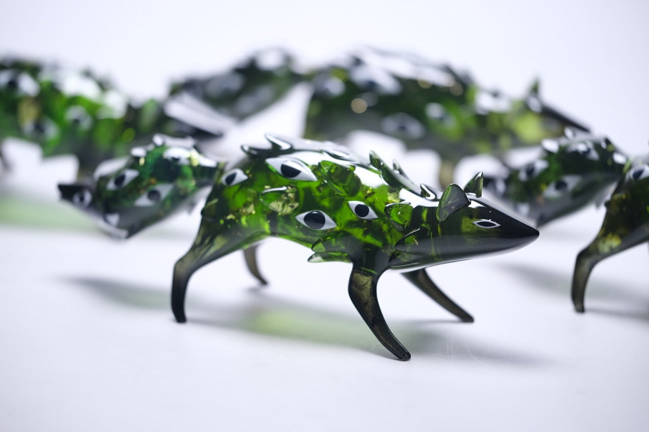 Bogwalker Oracle by Faunwood, translucent green glass animal sculptures with black insets, featuring unique designs, 10cm, limited edition of 100 pieces.