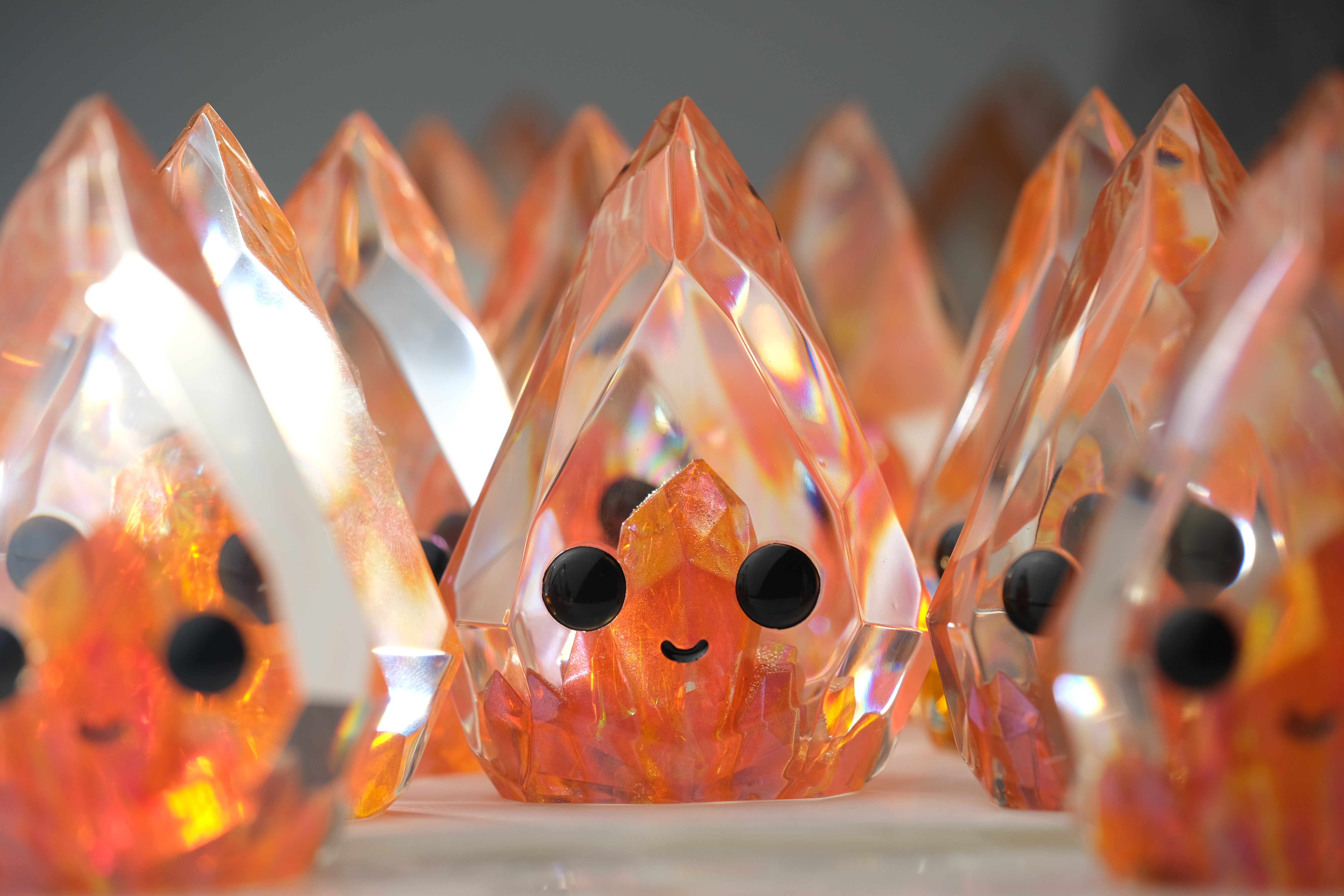 Fire Opal Prismite by Yutoos, a 3.5 handmade resin art piece, features intricate crystal-like and facial details, limited to an edition of 50.