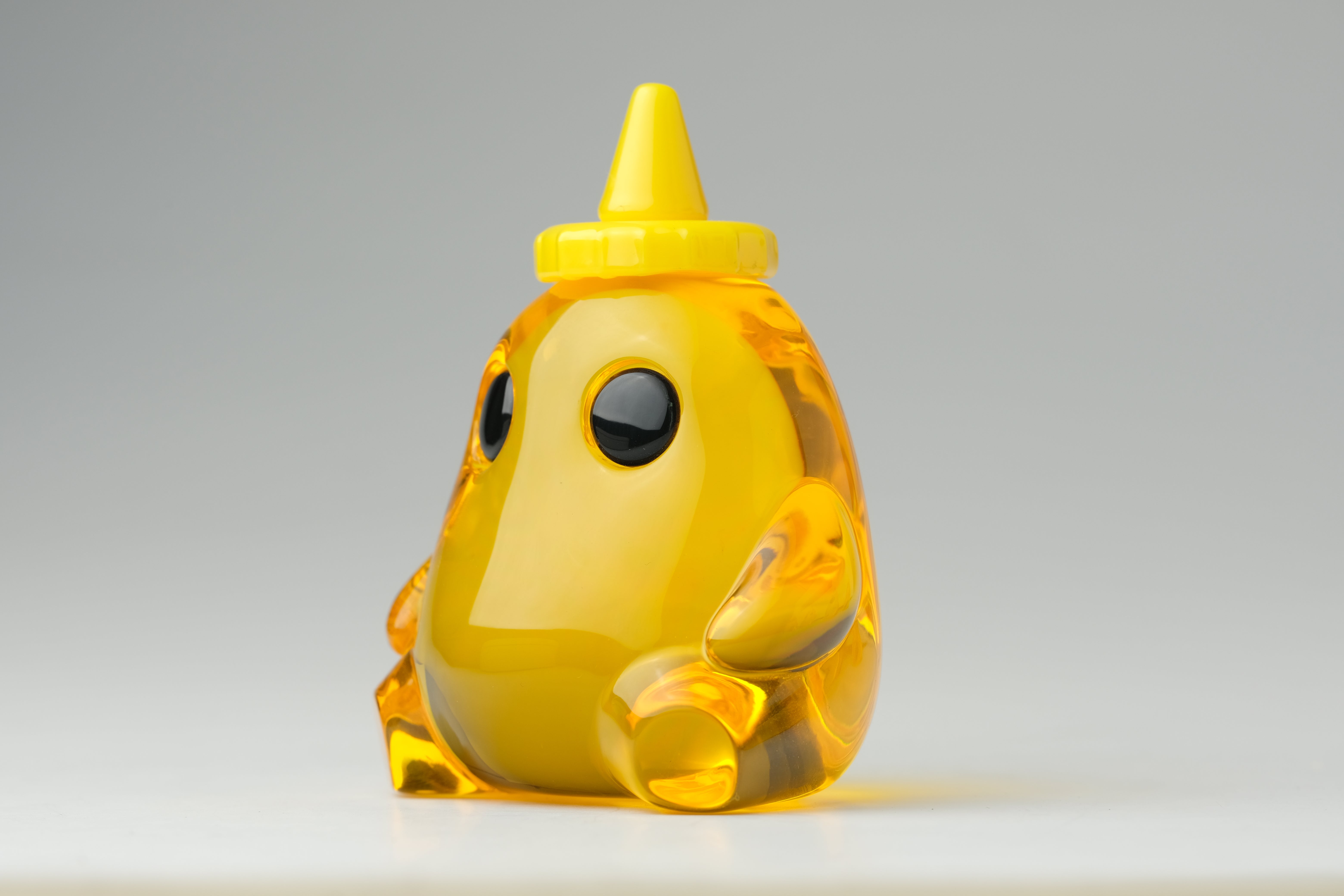 Honey Stubby by The Lostlings, a 3.5 resin cartoon animal figure, limited edition of 50, showcased in detail, emphasizing its playful, handcrafted design.