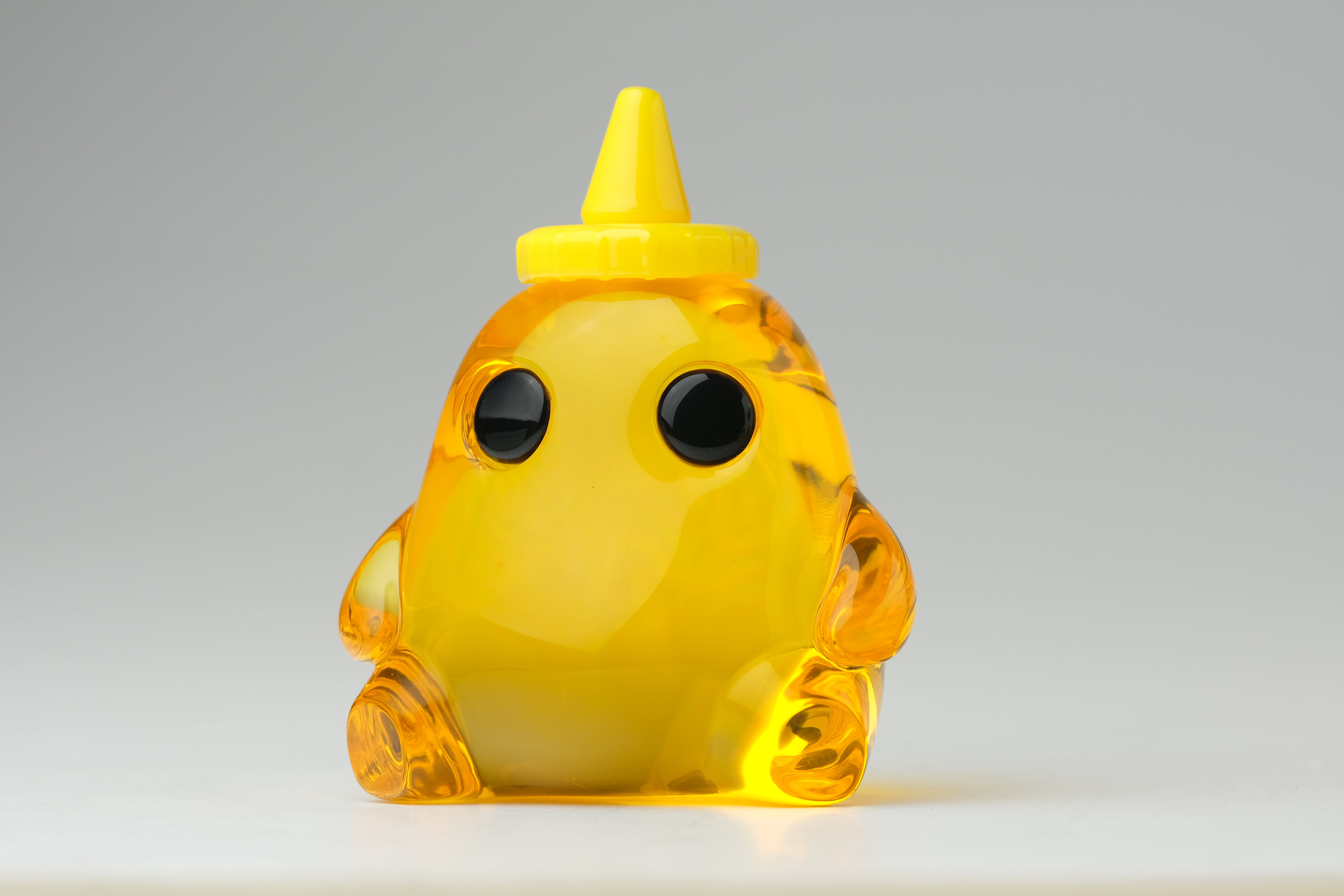 Honey Stubby by The Lostlings, a 3.5 resin toy, features a yellow cartoon animal figure, part of a limited edition of 50, ideal for collectors.
