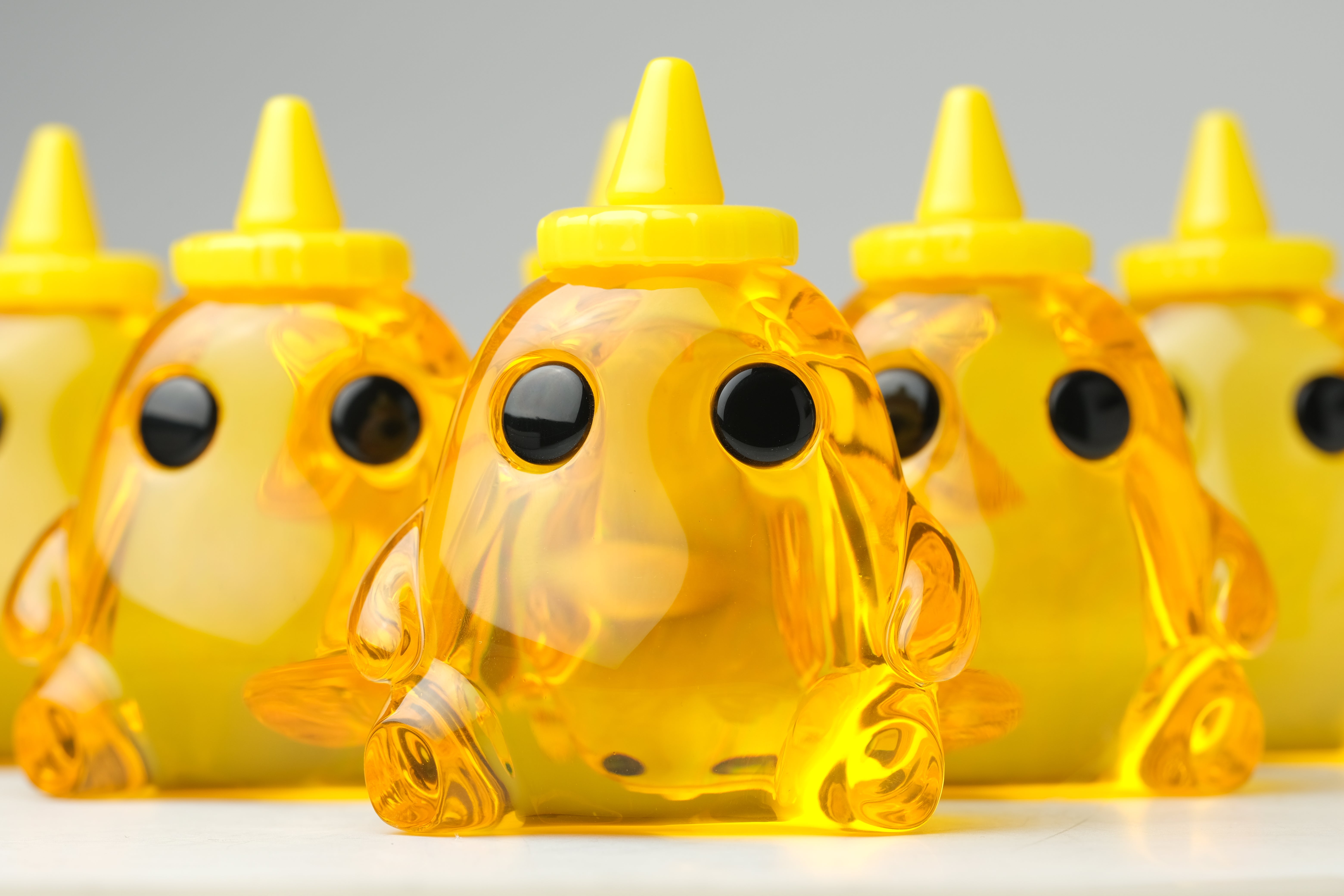 Honey Stubby by The Lostlings, a 3.5 resin toy depicting a stylized yellow animal figure, part of a limited edition of 50.