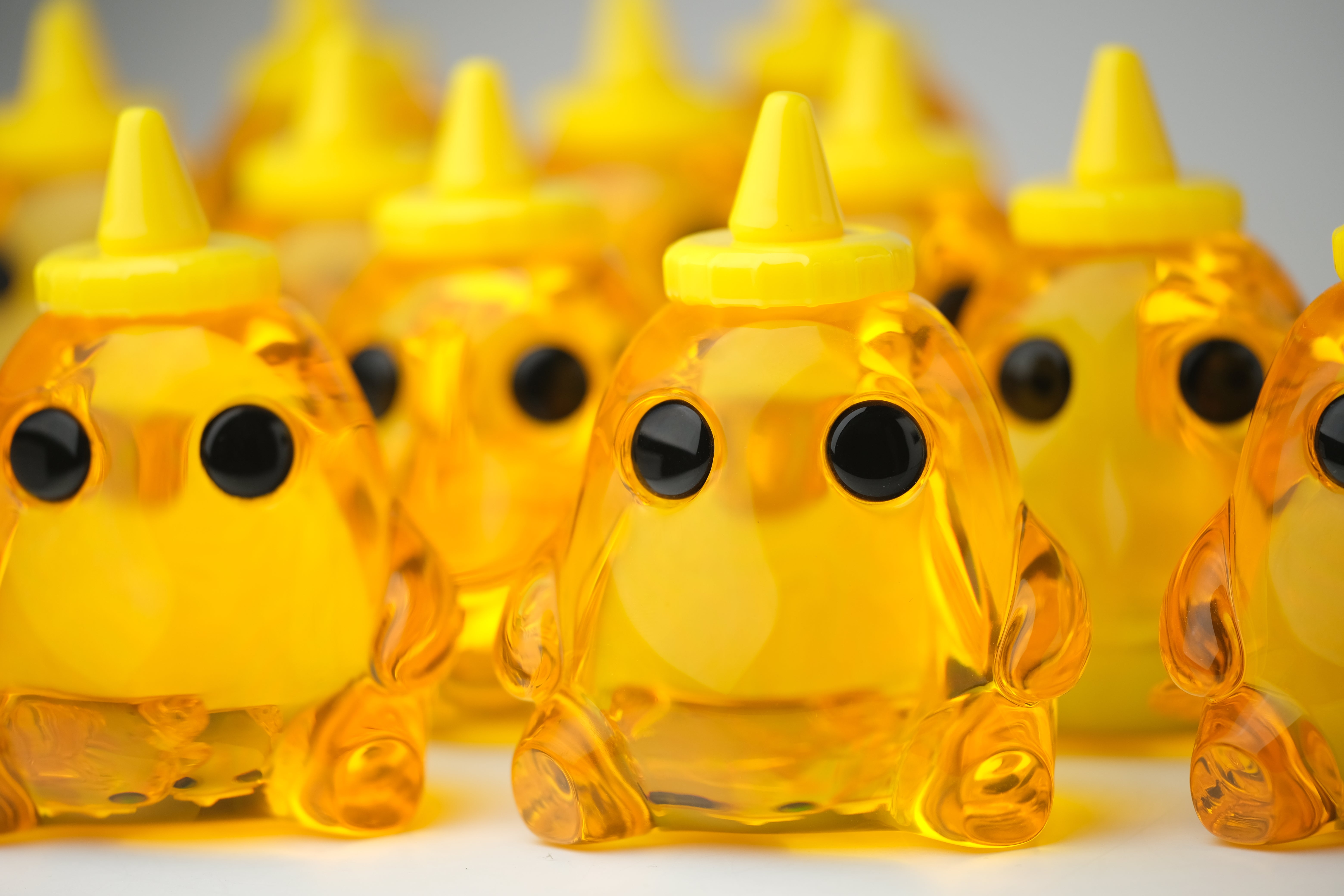 Honey Stubby by The Lostlings, a 3.5 resin art toy edition of 50, featuring a distinctive yellow cone shape and circular elements.