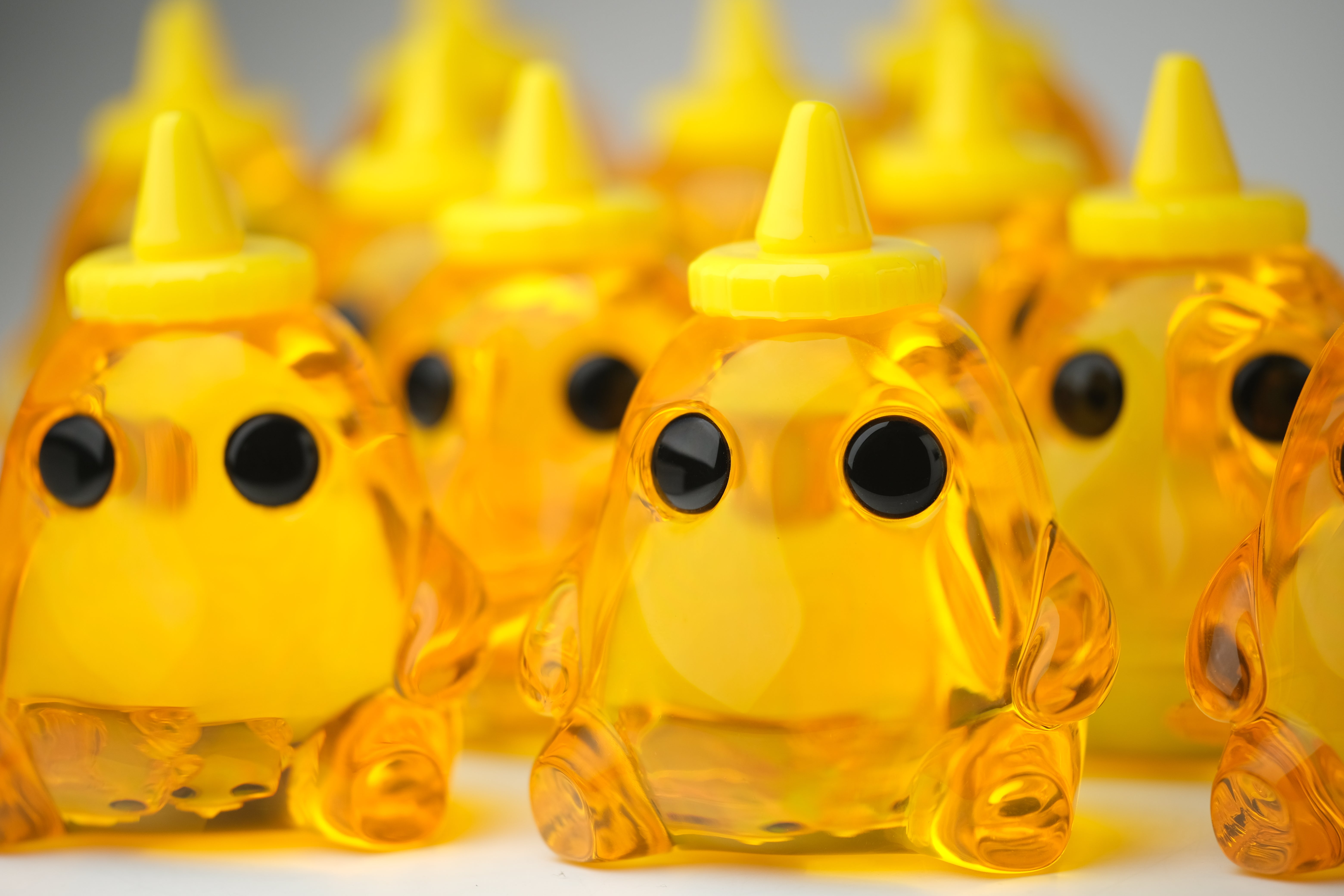 Honey Stubby by The Lostlings, a 3.5 resin art toy, features a unique yellow cone and black elements, part of a limited edition of 50.