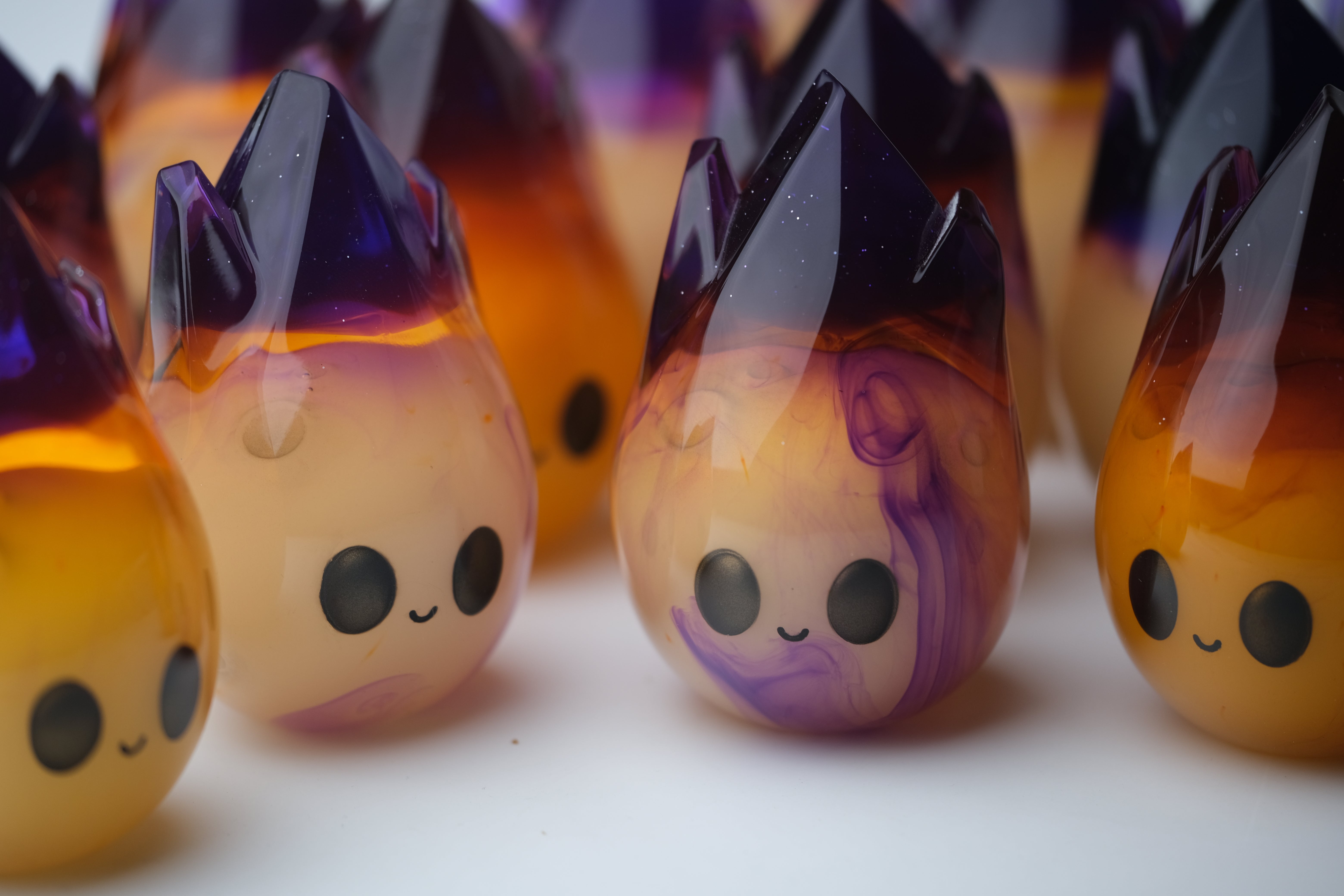 Cosmite by Yutoos, a 3.5 black resin art toy in a limited edition of 50, featuring a distinct oval shape.