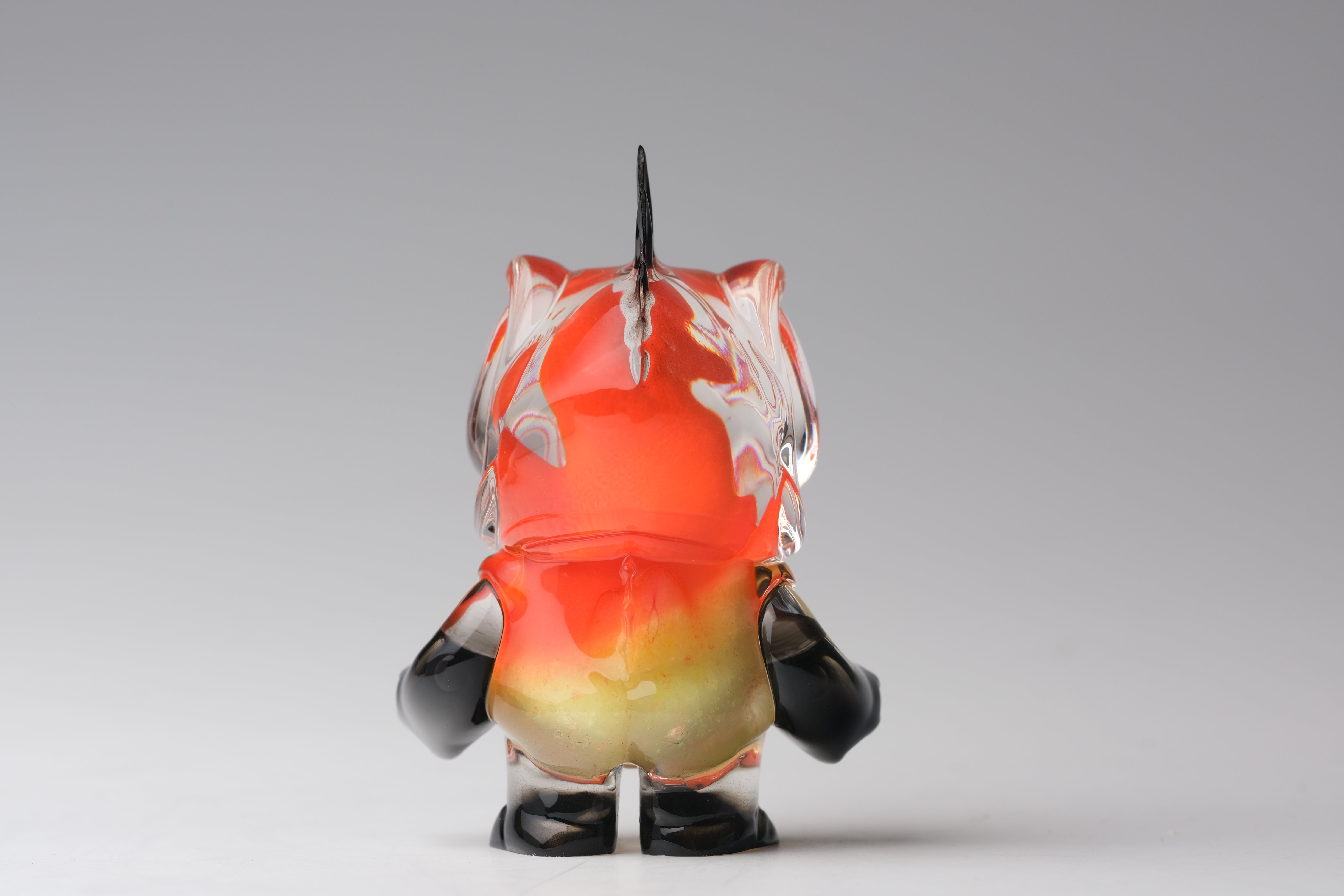 Angie Evo - Chicago Fire by 5th Turtle: A 3.5 limited-edition resin art toy with a vibrant gradient body and solid black arms and boots.