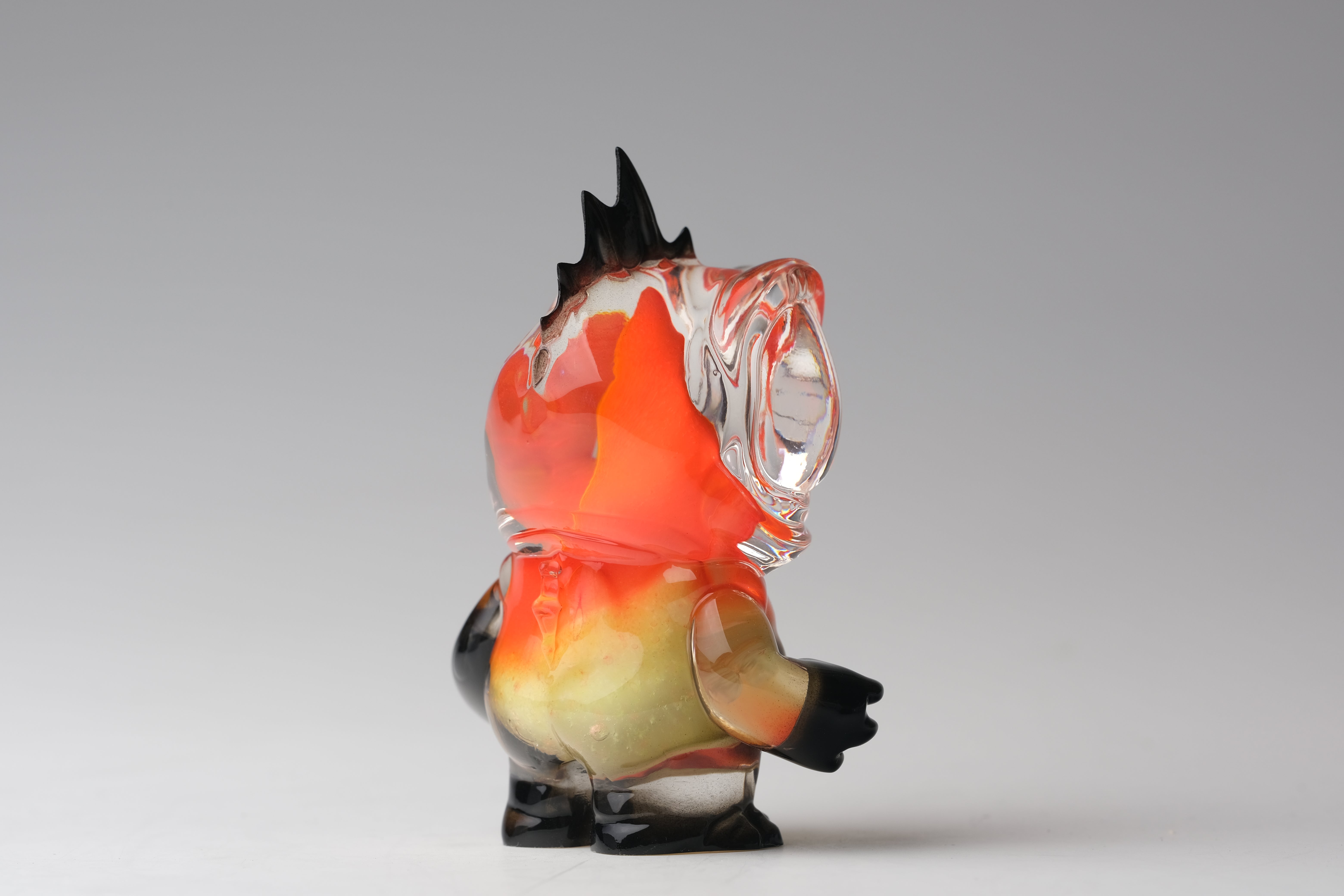 Angie Evo - Chicago Fire by 5th Turtle, a 3.5 limited edition hand-blown glass figurine with vibrant swirling colors and stumpy limbs, showcased on a neutral background.